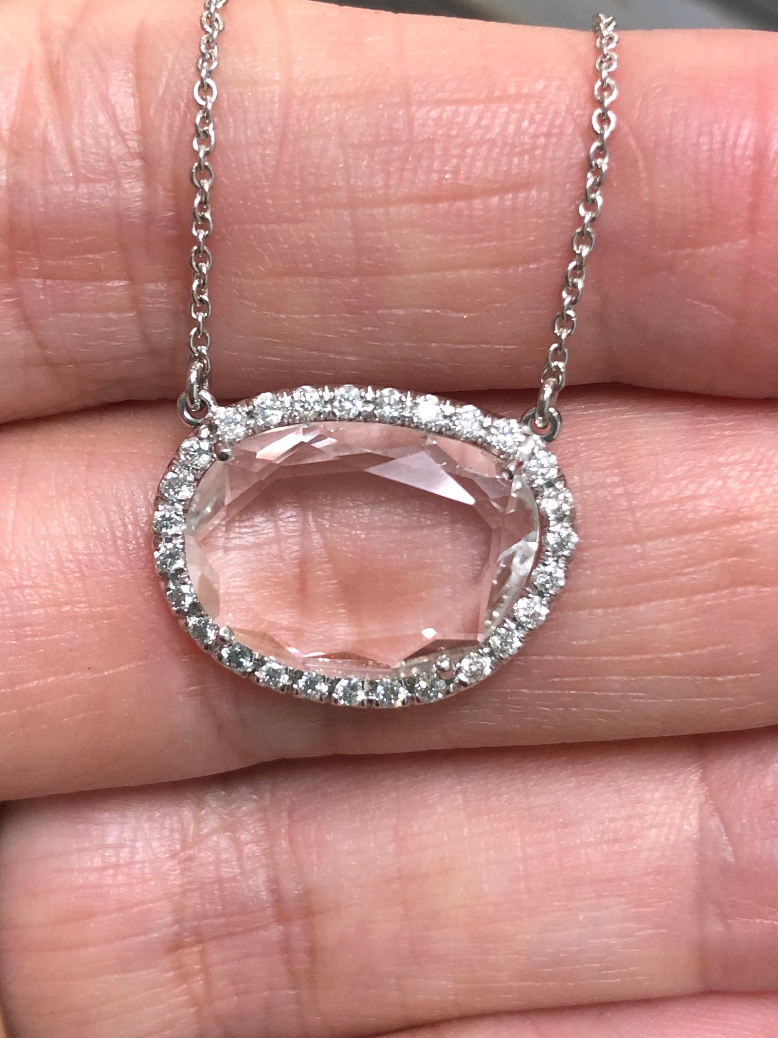 4.04 Carat Cobblestone Cut White Quartz with 27 Pave Set Diamonds Halo Pendant

This beautiful and graceful necklace is a one of a kind, handmade creation by H&H Jewels.  
It is a halo made of 27 pave set diamonds with a total weight of 0.30 carats,