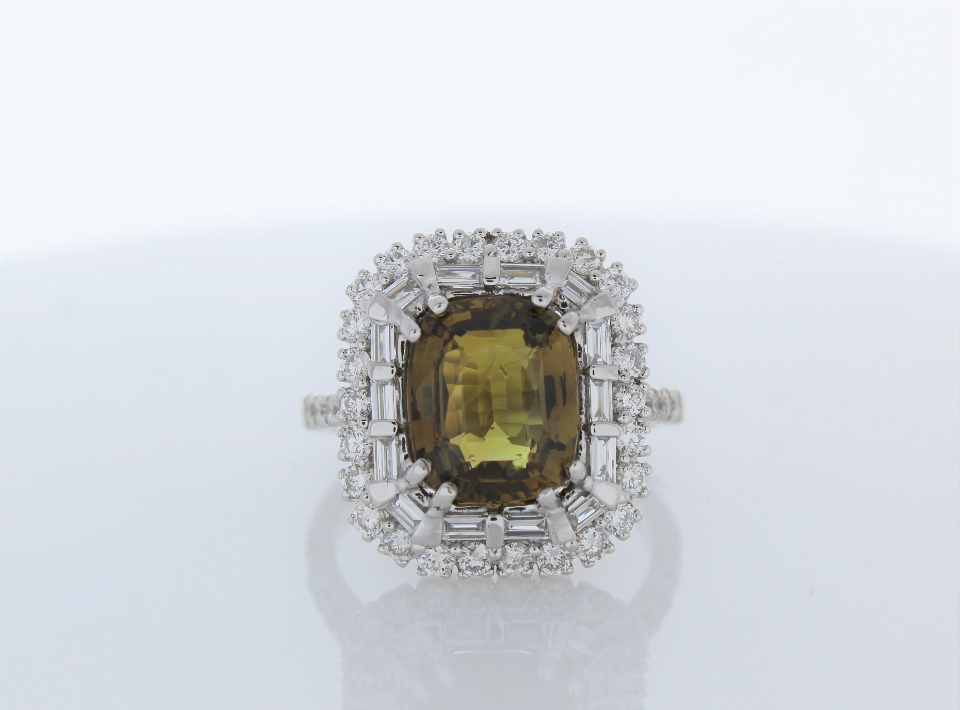 Your Alexandrite search is over. The 4.04 carat Alexandrite is one of the most important gems in our collection. It's BGL certified and cushion. It exhibits a brilliant olive green body with dancing undertones of light green across its pavilion. Its