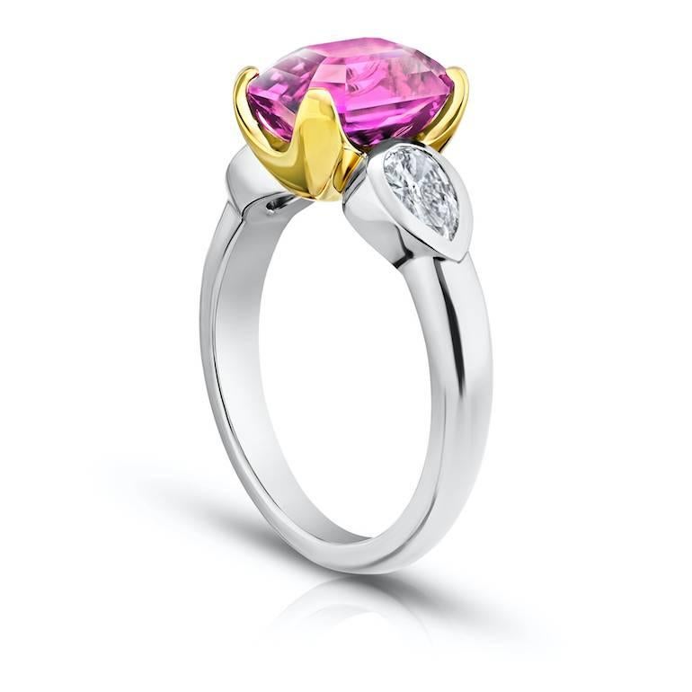 4.04 carat cushion pink sapphire with pear shape diamonds .54 carats set in a platinum with 18k yellow gold ring
