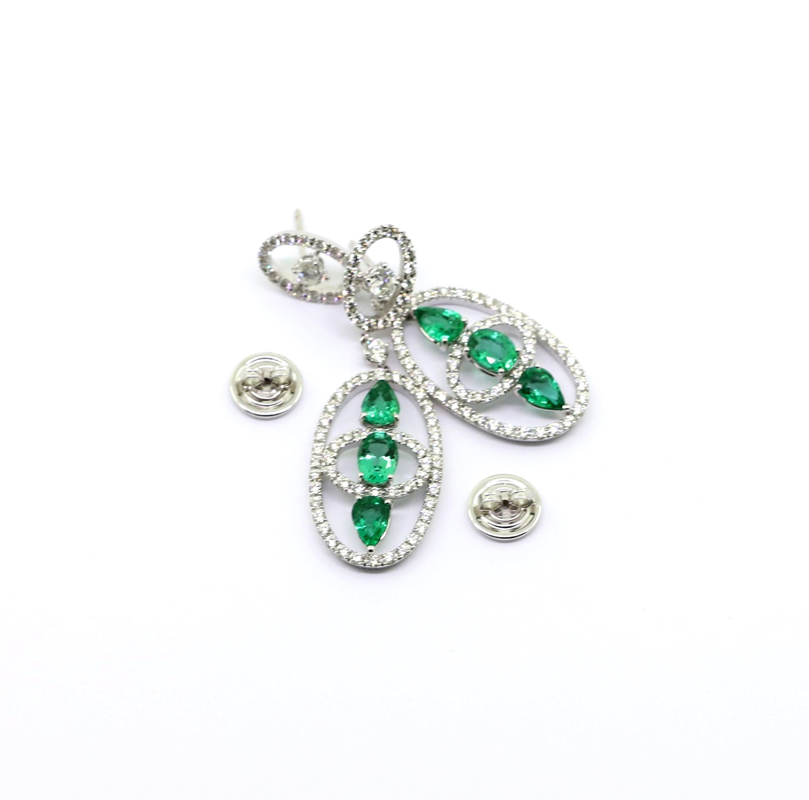 Pear Cut 4.04 Carat Emeralds and 3.06 Carat White Diamonds Dangle Earrings For Sale