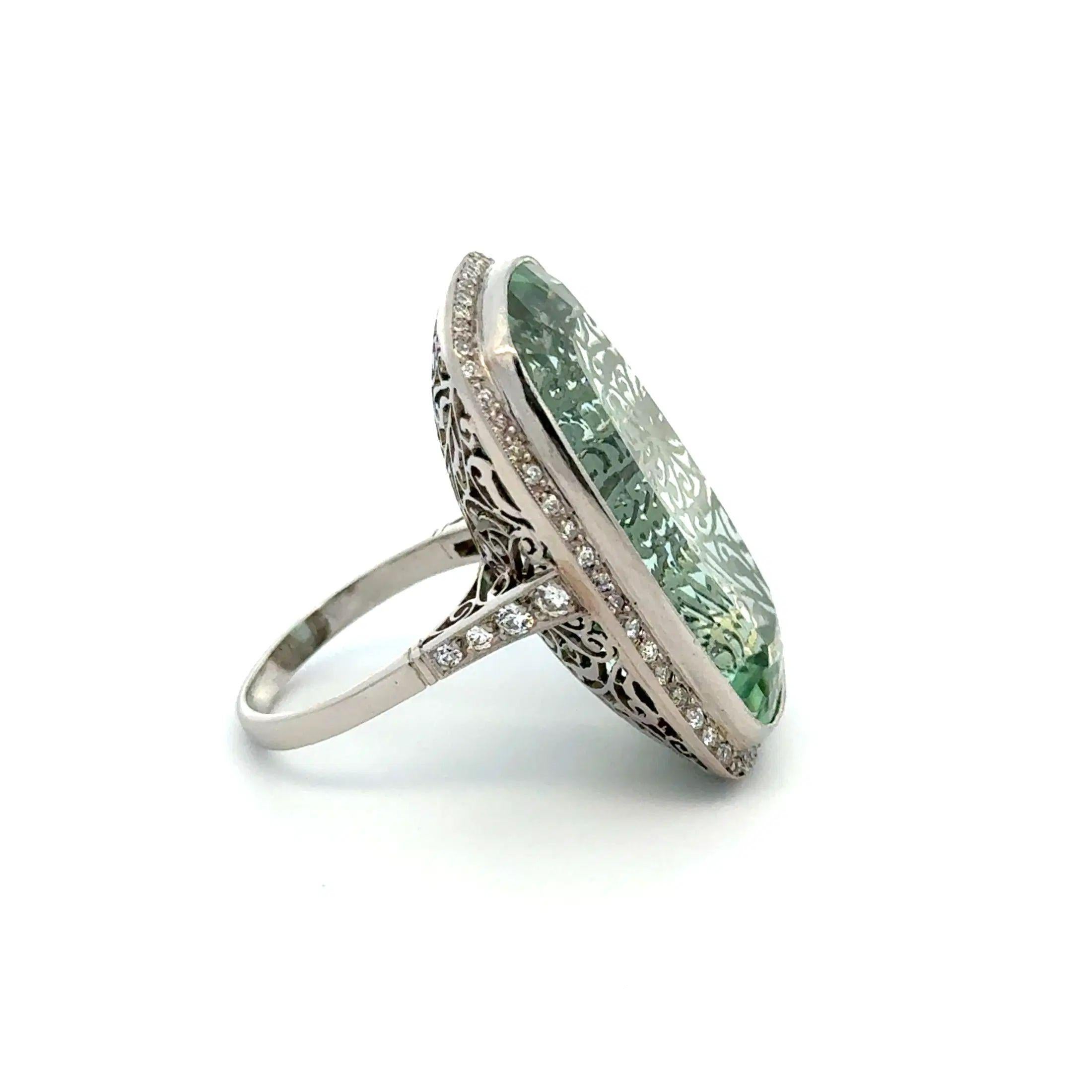 Simply Beautiful! Finely detailed Exquisite Statement Cushion Green Aquamarine and OEC Diamond Platinum Estate Vintage Cocktail Ring. Centering a securely nestled Hand set 40.42 Carat Rectangular Cushion Aquamarine Surrounded by a halo of Old