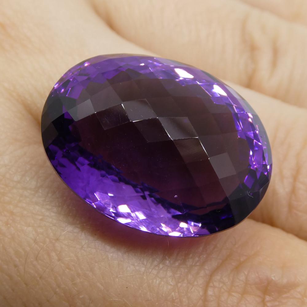 Description:

Gem Type: Amethyst 
Number of Stones: 1
Weight: 40.48 cts
Measurements: 26x19x15 mm
Shape: Oval Checkerboard
Cutting Style: 
Cutting Style Crown: Checkerboard
Cutting Style Pavilion: Modified Brilliant 
Transparency: