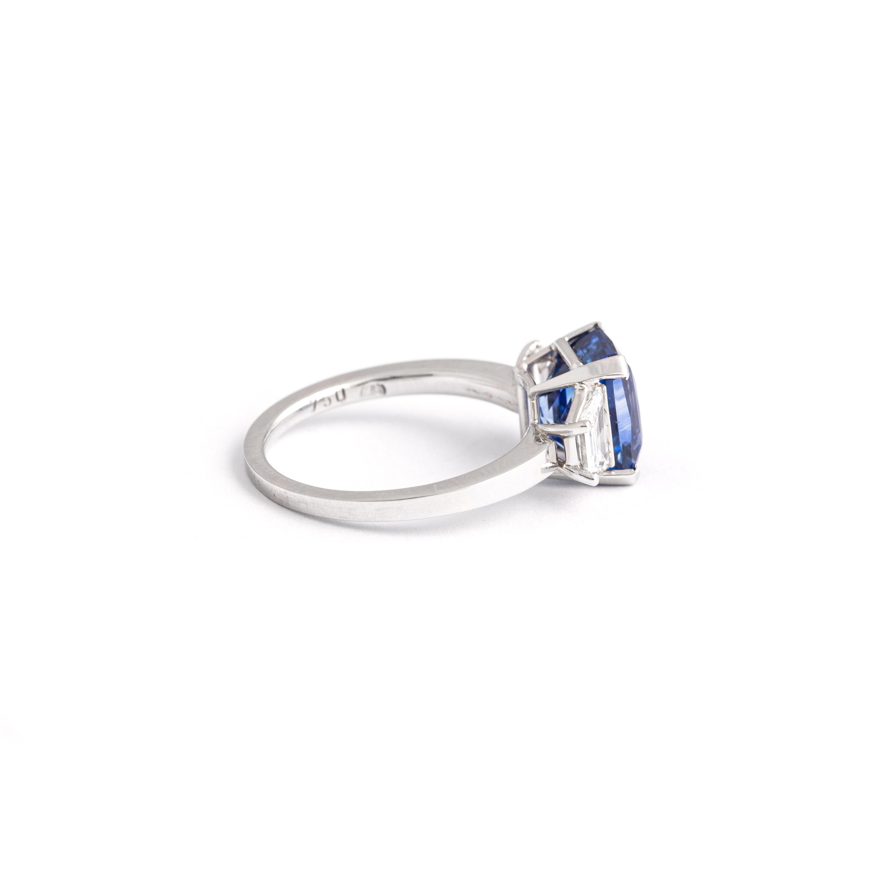 Emerald Cut 4.05 Carat Blue Sapphire White Gold Ring For Sale