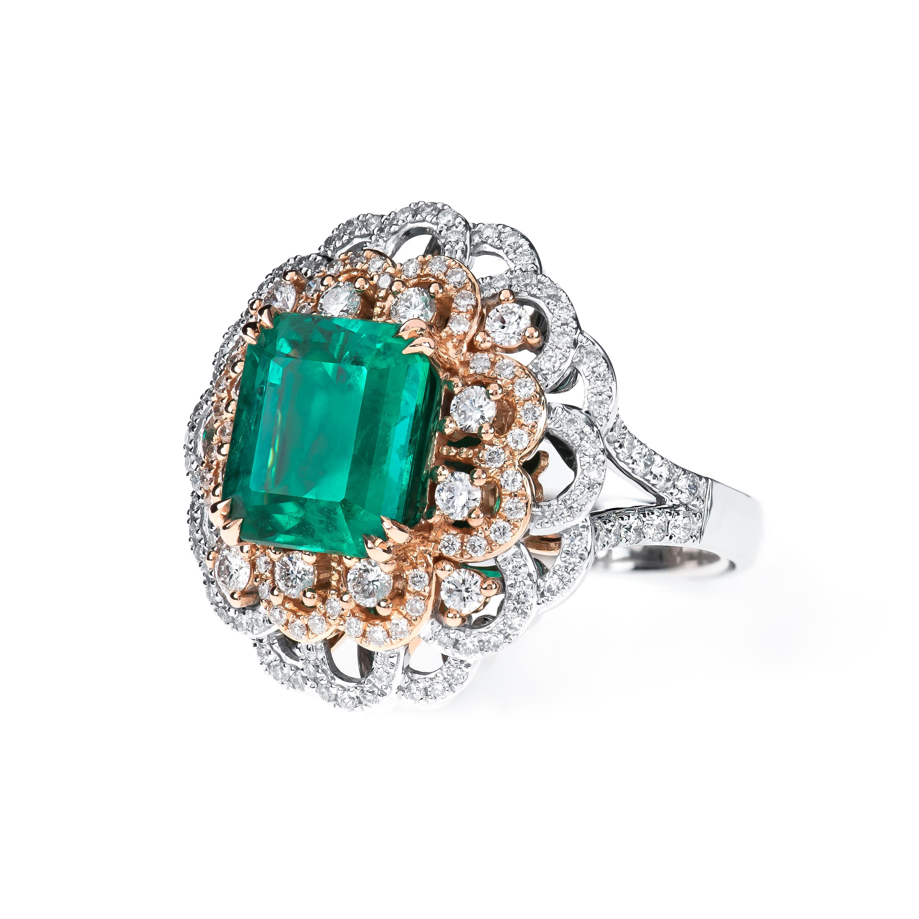 4.05ct Colombian emerald (GIA F1 minor oil) , octagonal step cut set  in an 18kt  rose and white gold cocktail ring with 1.27ctw in diamonds, diamond quality is F-G color, VS2-SI1 clarity. Ring size 7, can be sized larger or smaller upon request.