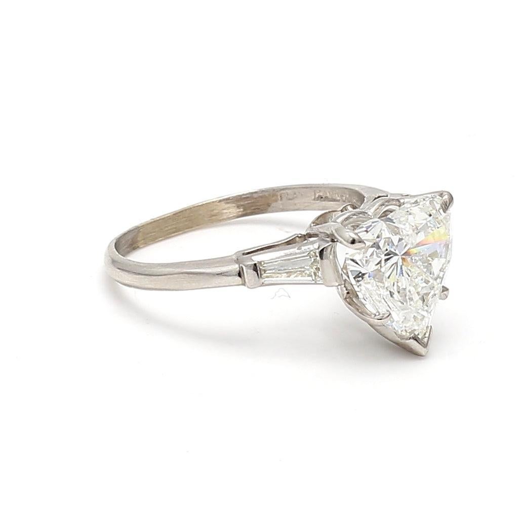 Title:
4.05 Carat Heart Shape F I1 and Tapered Baguette Shape F SI2 Diamond Platinum Engagement Ring


Style:
Engagement


Metal:
Platinum


Gemstone 1:
0.44 Carat Diamond


Number of Stones:
2


Color:
F


Clarity:
SI2


Shape:
Tapered Baguette