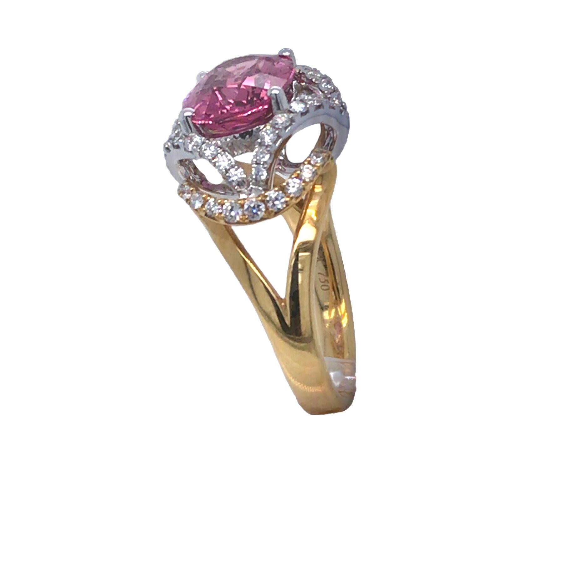 Indulge in timeless elegance with this exquisite ring, a symphony of sophistication and allure. At its heart lies a mesmerizing 4.05 carat oval-cut peach garnet, radiating warmth and charm. Encircled by a halo of resplendent natural diamonds,