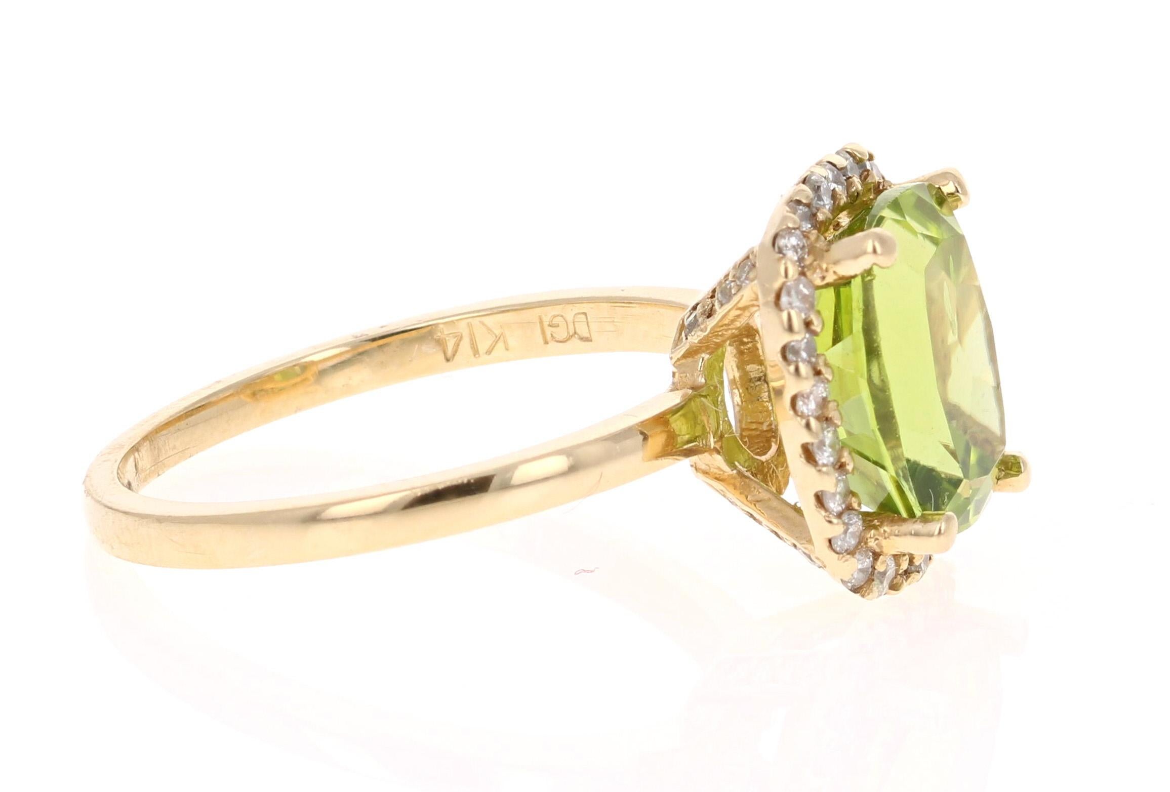Bright, Beautiful and Bling! 

This Peridot and Diamond Ring has a 3.72 Carat Cushion Cut Peridot and has a halo of 42 Round Cut Diamonds weighing 0.33 Carats. The total carat weight of the ring is 4.05 Carats. 

It is set in 14 Karat Yellow Gold
