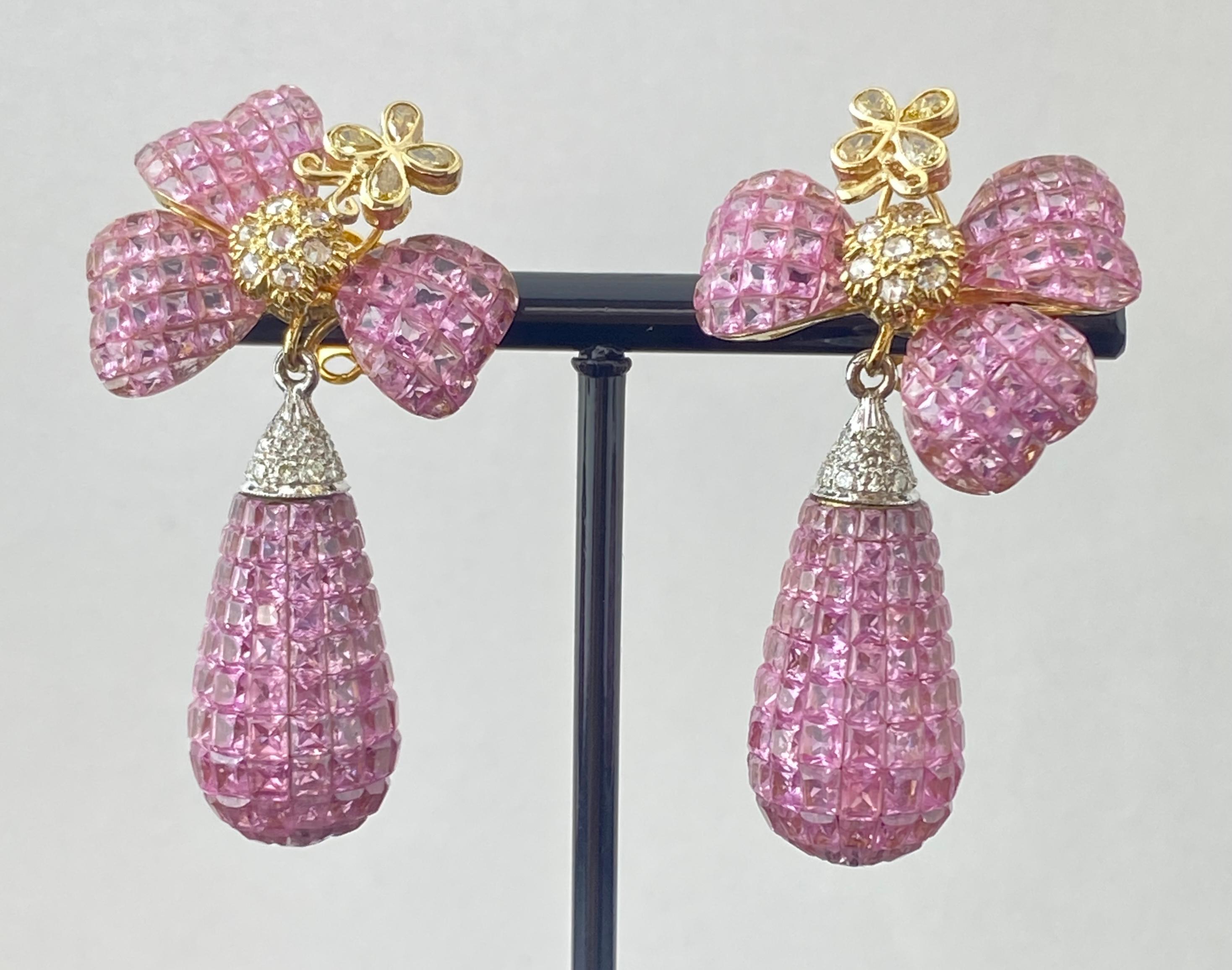 A poetic ode to nature’s beauty, these exceptional earrings bloom with artistry and color. Featuring 40.50 carats of invisibly set pink sapphires sculpted into floral motifs and graceful drops, they exude a soft yet commanding presence. Accented by