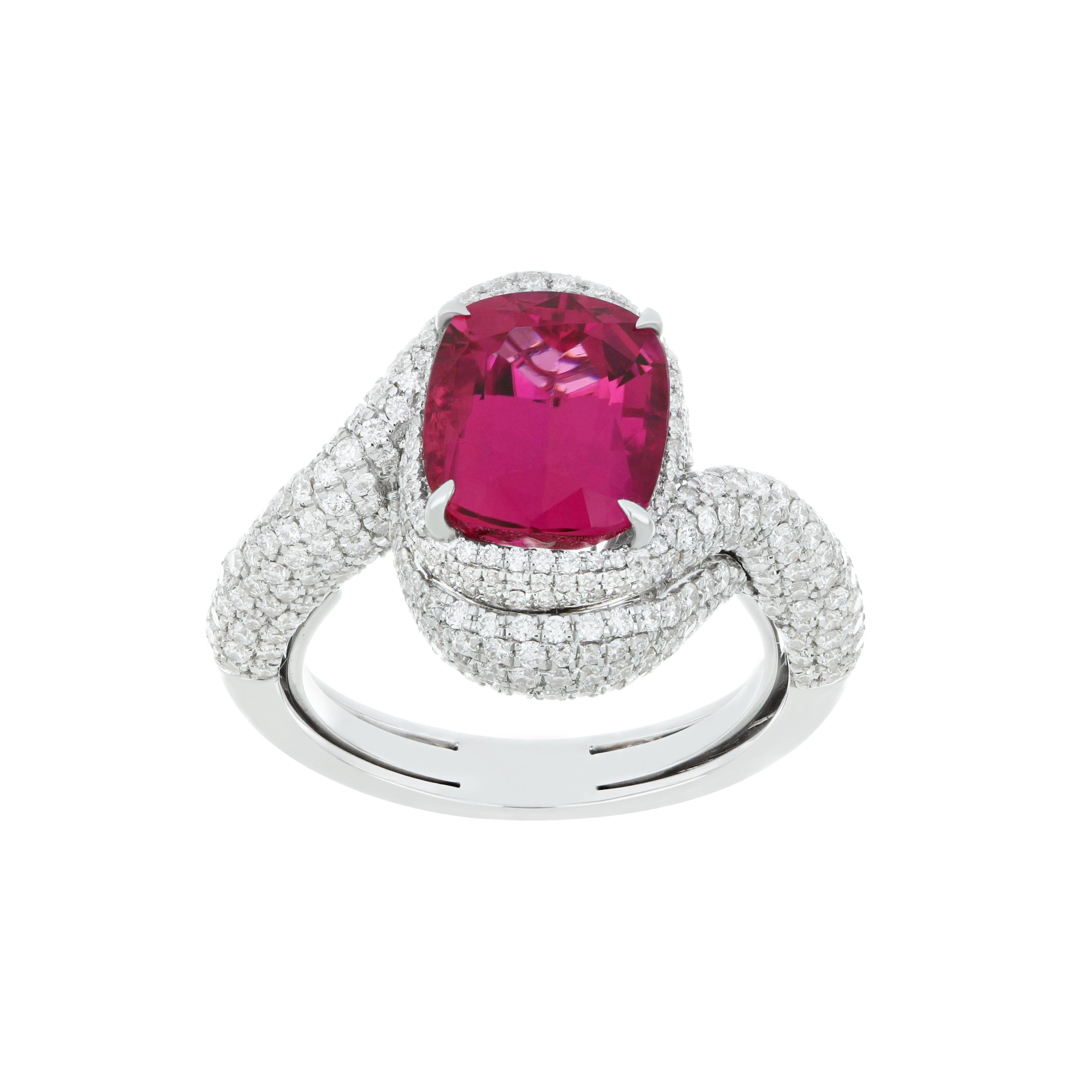 Elegant and exquisitely detailed 18K White Gold Ring, with 4.05Cts Cushion Round Corner Shape Rubellite set in center and Surrounded by Micro pave Diamonds, weighing approx. 1.7 CT's. total carat weight to further enhance the beauty of the ring.