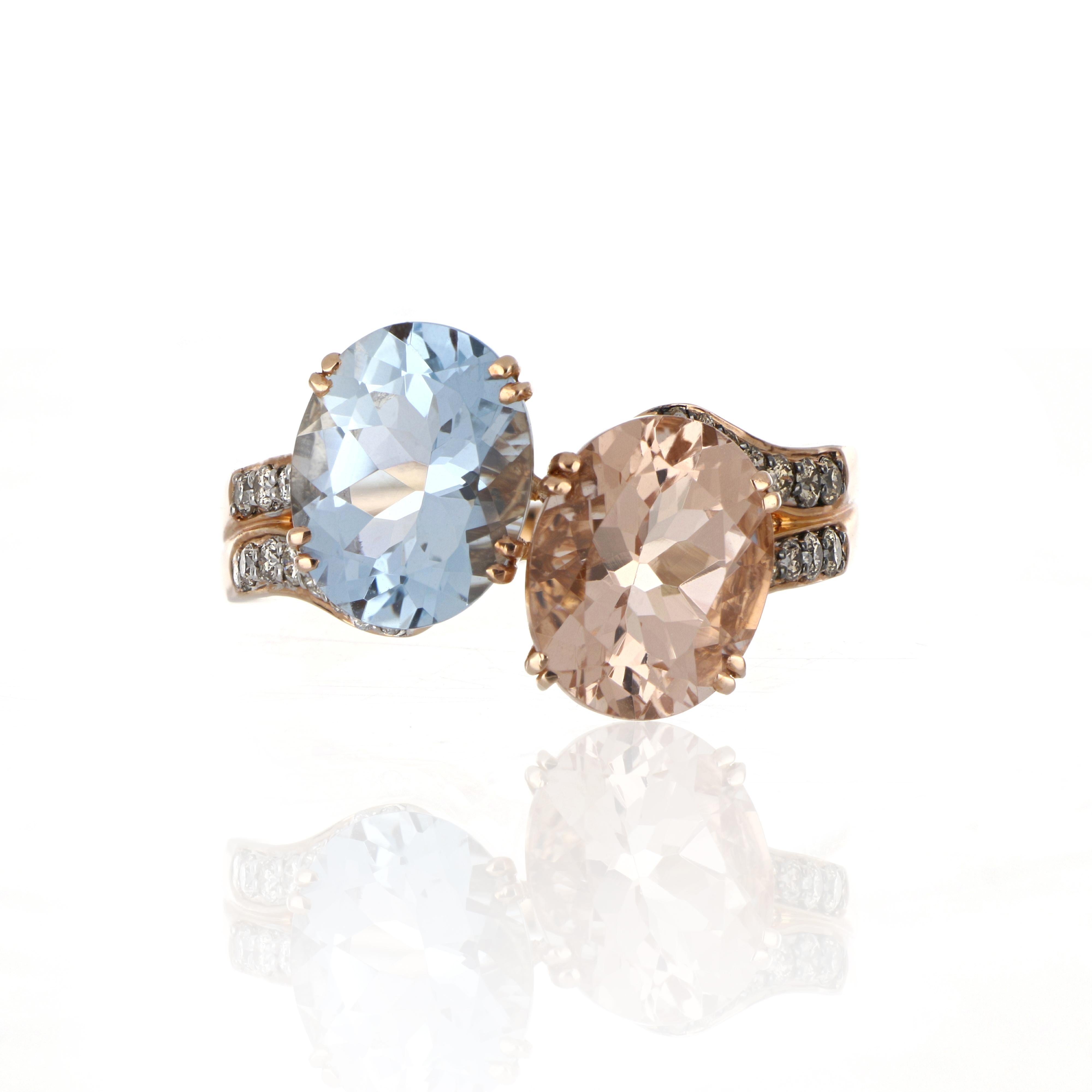 Elegant and exquisitely detailed Cocktail 14K Ring, centre set with 1.89 Cts. Oval Morganite and 2.16 Cts. Oval Aquamarine. Surrounded and enhanced on shank with white and Chocolate Diamonds, weighing approx. 0.20 ct. Beautifully Hand crafted in 14
