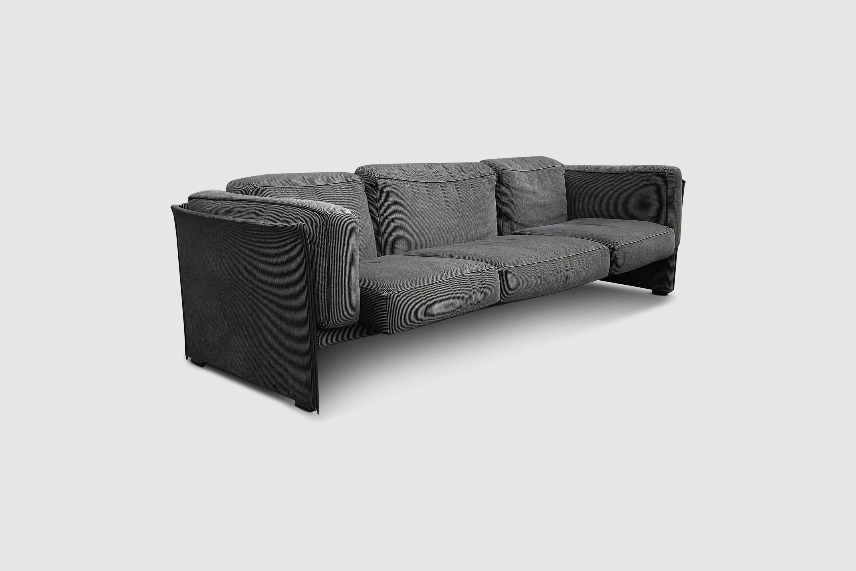 Beautiful time piece sofa by Mario Bellini for Cassina in original dark grey and white striped Missoni fabric.

The 405 Duc was designed by Bellini in the 70s as a minimalistic approach for a comfy sofa.

Made with panel structure assembled by