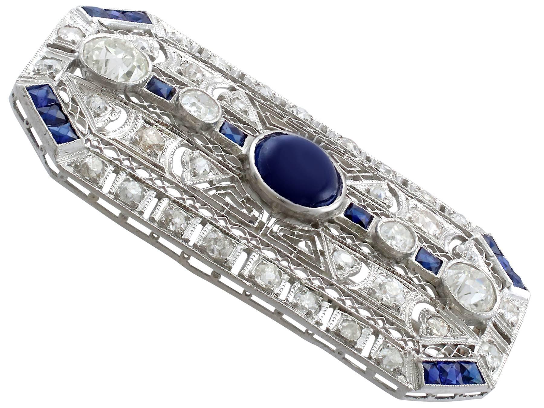 A stunning, fine and impressive (circa 1970) 4.10 carat blue sapphire and 4.05 carat antique (circa 1910) diamond, platinum brooch in the Art Deco style; part of our diverse estate jewelry collections

Description

This stunning, fine and impressive