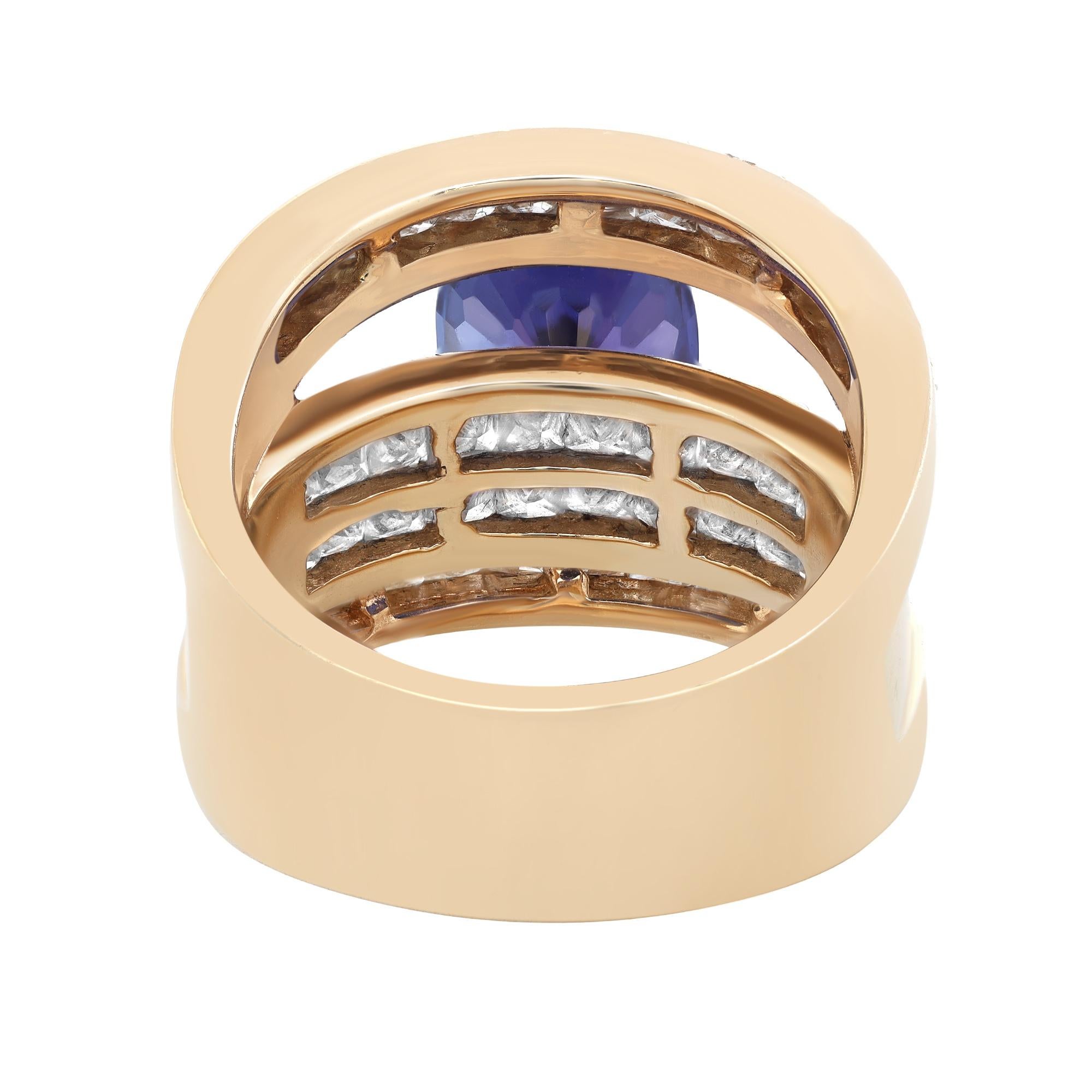 This stunning cocktail ring comes with a flashy statement look. A must have in your jewelry collection. The ring is crafted in 14k yellow gold. Features oval cut bluish violet Tanzanite weighing 3.88 carats flanked with 48 bright white princess cut