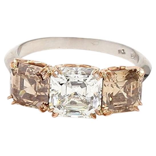 4.06 Carat Asscher Cut Fancy Y-O-B Diamond 18K Gold Three-Stone Ring