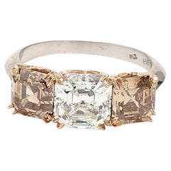 4.06 Carat Asscher Cut Fancy Yellow Orange Diamond 18K Gold Three-Stone Ring