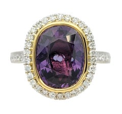 4.06 Carat Oval Cut Color-Change Garnet Ring with Diamond Halo in 18 Karat Gold