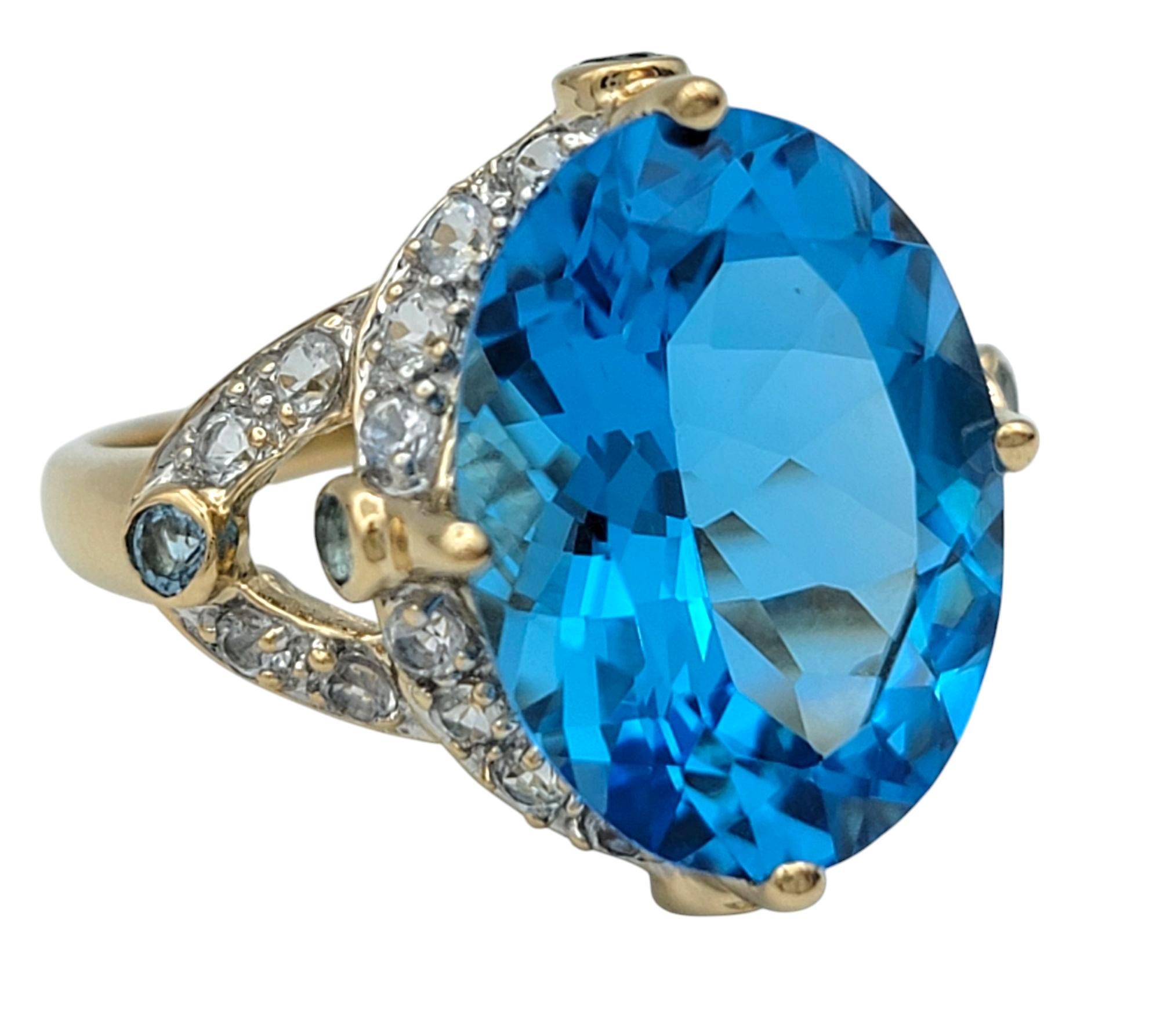 Oval Cut 4.06 Carat Swiss Blue Topaz Cocktail Ring with White Topaz 14 Karat Yellow Gold For Sale