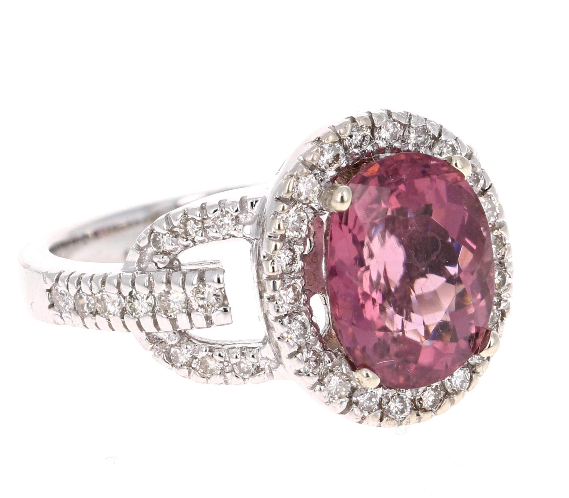Super gorgeous 4.06 Carat Pink Tourmaline and Diamond 14K White Gold Cocktail Ring!

This ring has a 3.46 carat Oval Cut Tourmaline that is set in the center of the ring and is surrounded by 44 Round Cut Diamonds that weigh 0.60 carats . The total