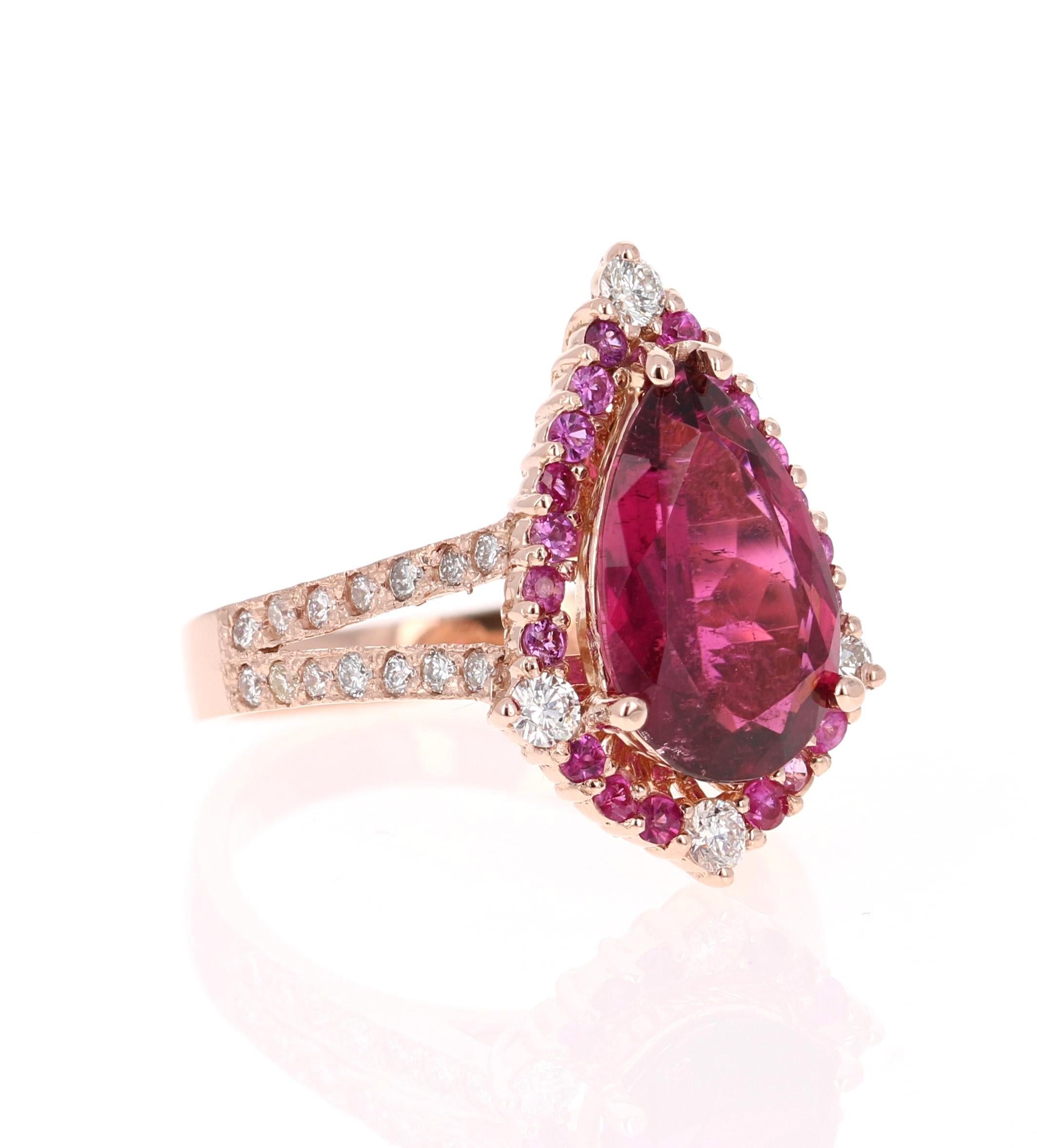 Stunning and uniquely designed 4.06 Carat Pink Tourmaline, Pink Sapphire Diamond Rose Gold Cocktail Ring! 

This ring has a beautiful and bold 3.19 Carat Pear Cut Tourmaline that measures at 8 mm x 12 mm (width x length) and is surrounded by 20 Pink