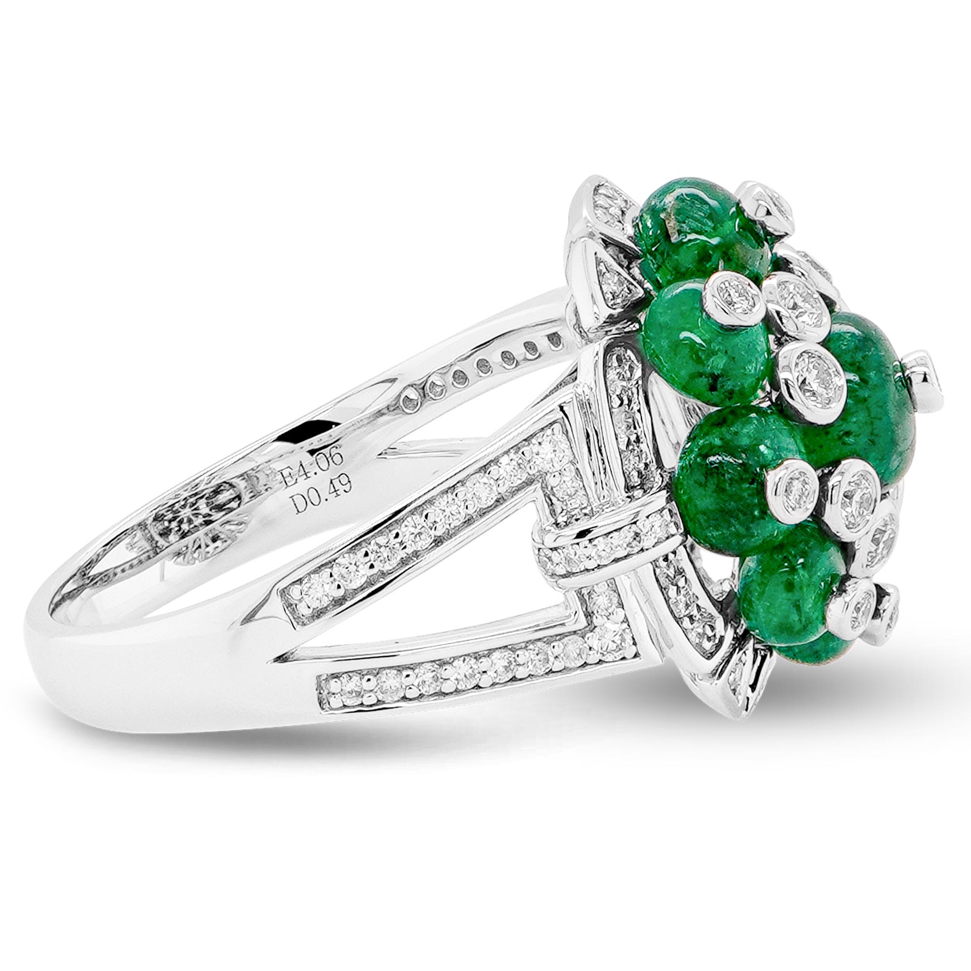 This exquisite ring showcases a captivating display of vibrant green emerald beads totaling 4.06 carats.  Their rich, verdant hue evokes a sense of lushness and vitality.  The emerald beads, carefully selected for their intense color and clarity,