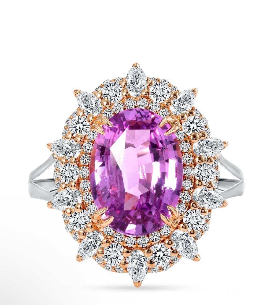 A distinctive 4.06-carat untreated pink sapphire from Sri-Lanka is the star of this ring. Ten pear-shaped and numerous round sparkling diamonds support this all-natural sapphire. 

Beautifully crafted in platinum with 18K yellow gold, the romantic