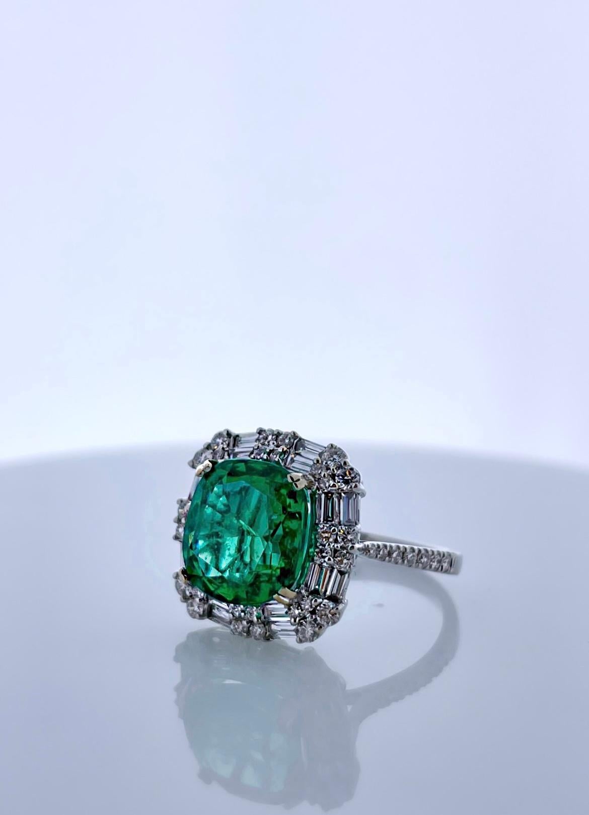 Contemporary 4.06CT Green Emerald and 1.10CTW Diamond Ring in 18k White Gold For Sale