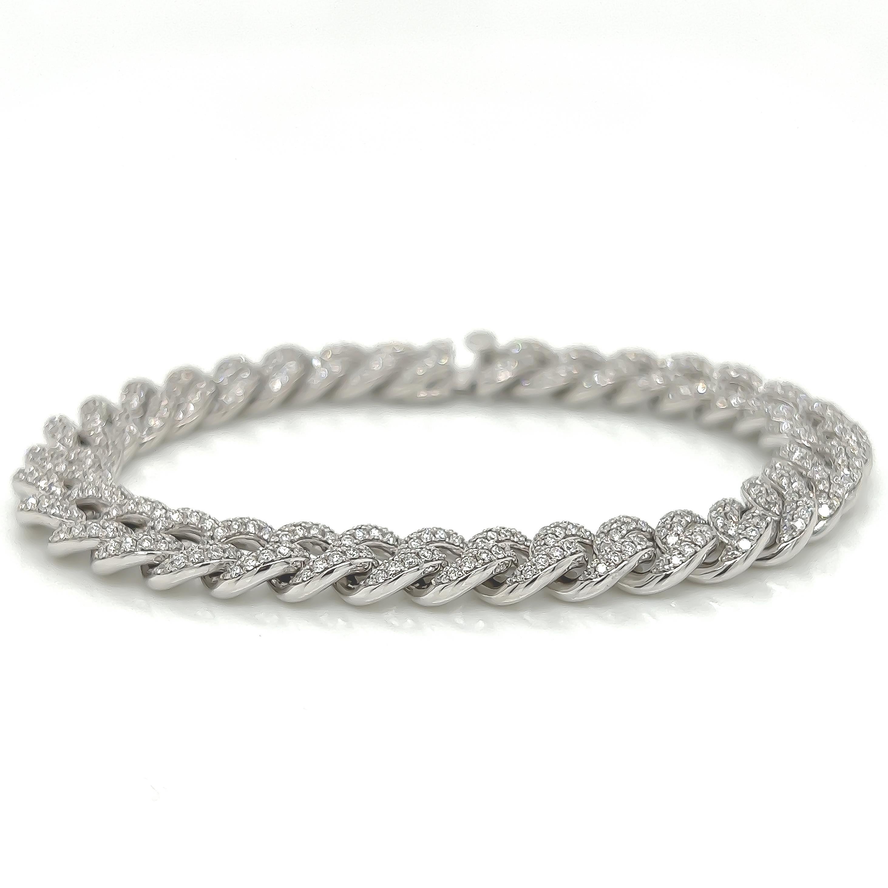 4.07 Carat 14K White Gold Iced Out Cuban Link Diamond Bracelet, 22.8g 

This handmade cuban link diamond bracelet weighs 22.8 grams. It boasts 4.07 Carats of sparkling round cut white diamonds exquisitely pave set into cuban links. The bracelet is