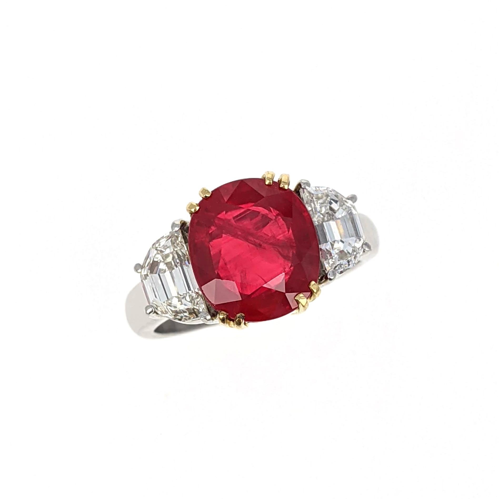 This beautiful ring centers upon an oval-shaped ruby weighing 4.07 carats and is flanked by two half moon-shaped diamonds. It is mounted in platinum and yellow gold. Size 5.5.

Accompanied by a report from the AGL laboratory stating that the ruby is