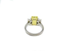 4.07 Carat Fancy Vivid Emerald Cut Yellow Diamond Three Stone Engagement Ring