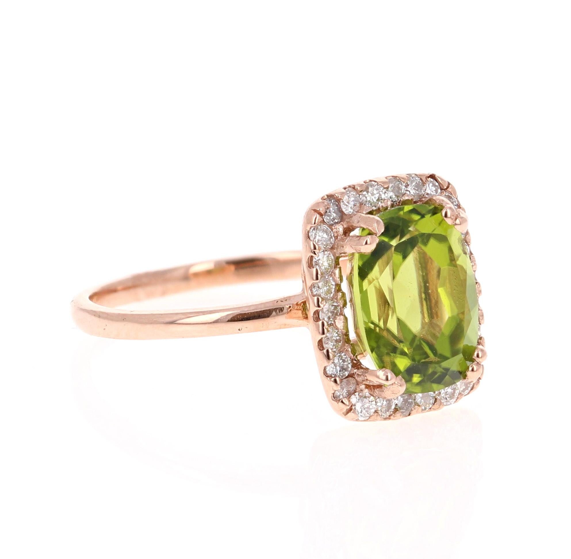 This Peridot and Diamond Ring has a 3.70 Carat Oval-Cushion Cut Peridot and has a halo of 26 Round Cut Diamonds weighing 0.37 Carats. The total carat weight of the ring is 4.07 Carats. 

It is set in 14 Karat Rose Gold and weighs approximate 3.2