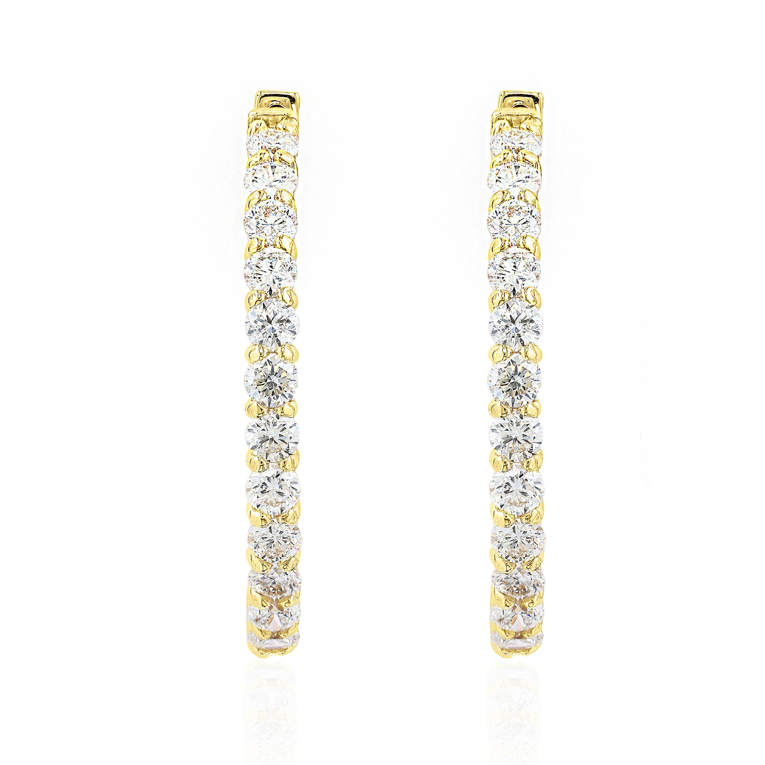 A chic and fashionable pair of hoop earrings showcasing  round diamonds, set in 14k yellow gold.  46 Round diamonds weigh 4.07 carats total. A beautiful piece of jewelry.


All diamonds are GH color SI1 Clarity.
Available in Yellow and Rose Gold as
