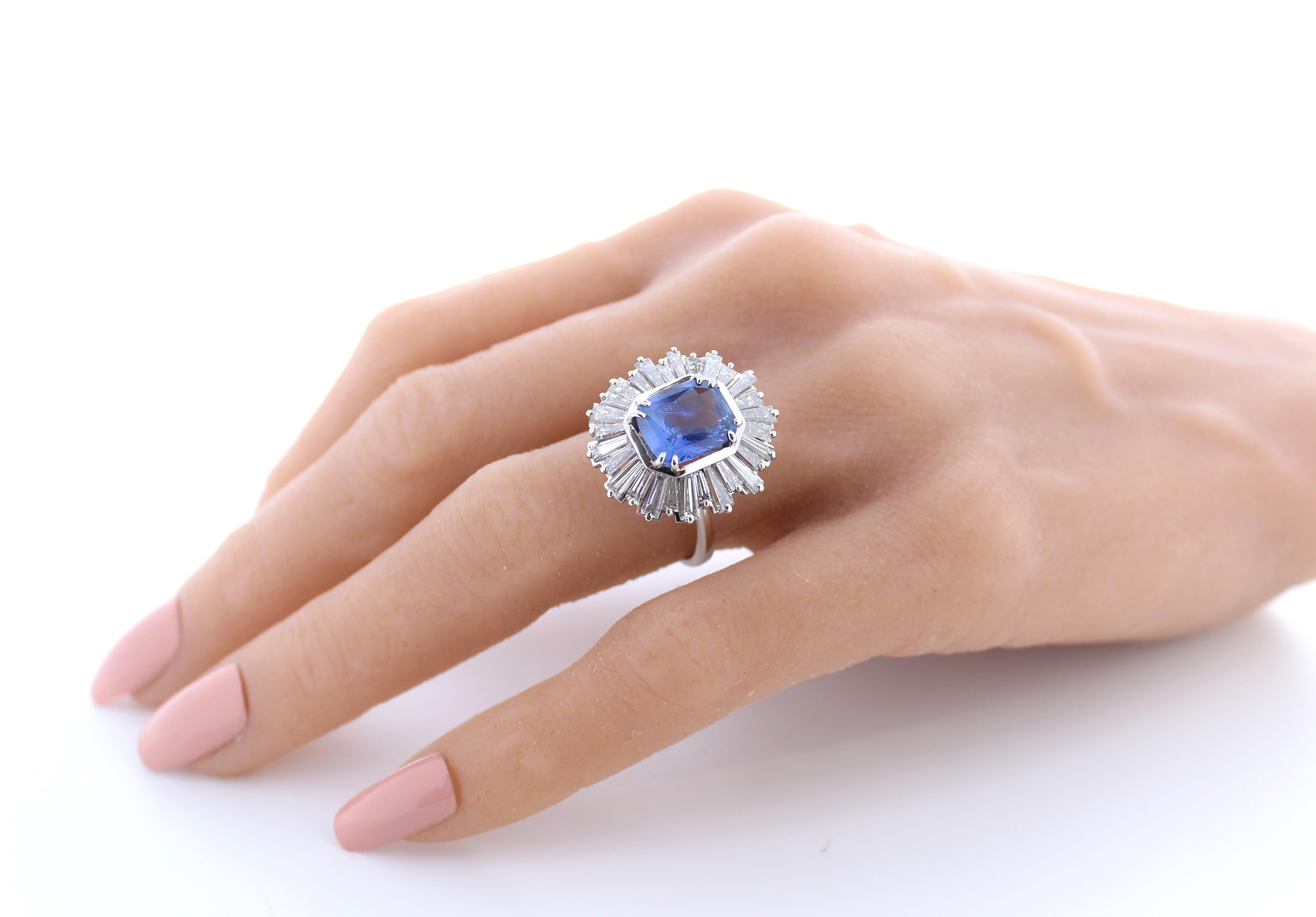 A fashion ring featuring a combination of platinum with a main stone of a certified unheated blue sapphire weighing 4.07 carats in a cushion cut, accompanied by 28 baguette-cut diamonds totaling 3 carats as side stones, would be an exquisite and