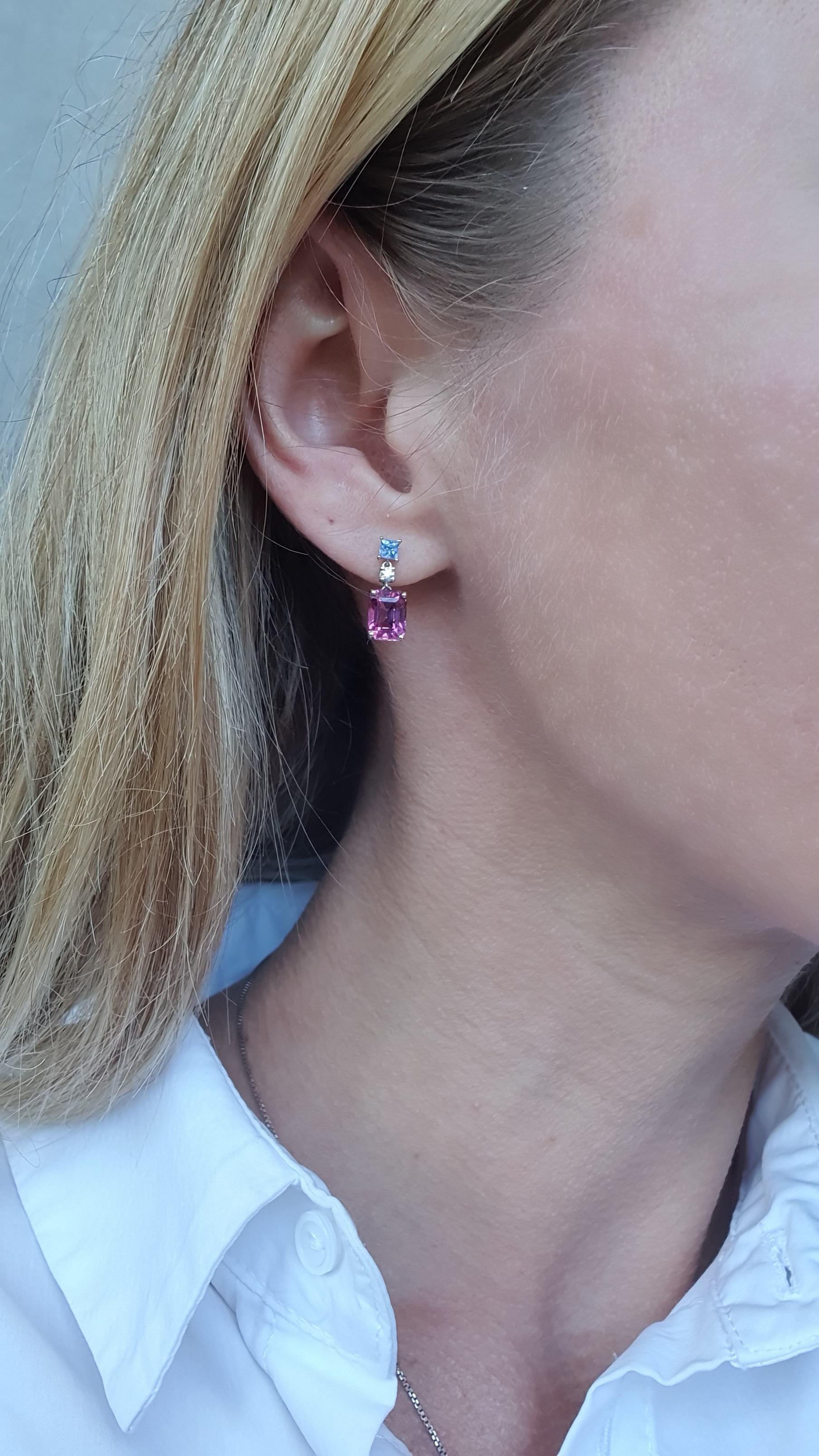  For the most elegant jewellery collectors ALPENGEM created these exquisite radiant cut sapphire and diamond earrings with suspended flawless scissor cut purple garnets.

These rich cold hue gems are in 18 K white gold, which make them an ideal