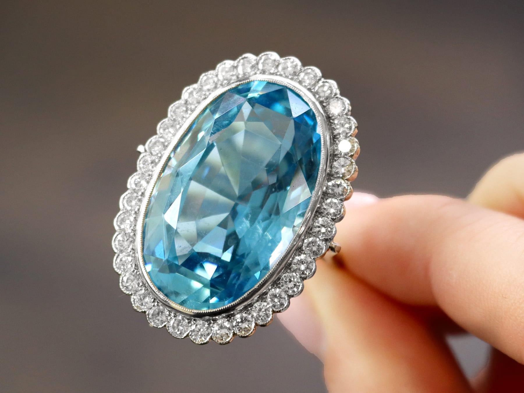 Oval Cut 40.72 Carat Aquamarine and 1.82 Carat Diamond Platinum Cocktail Ring For Sale