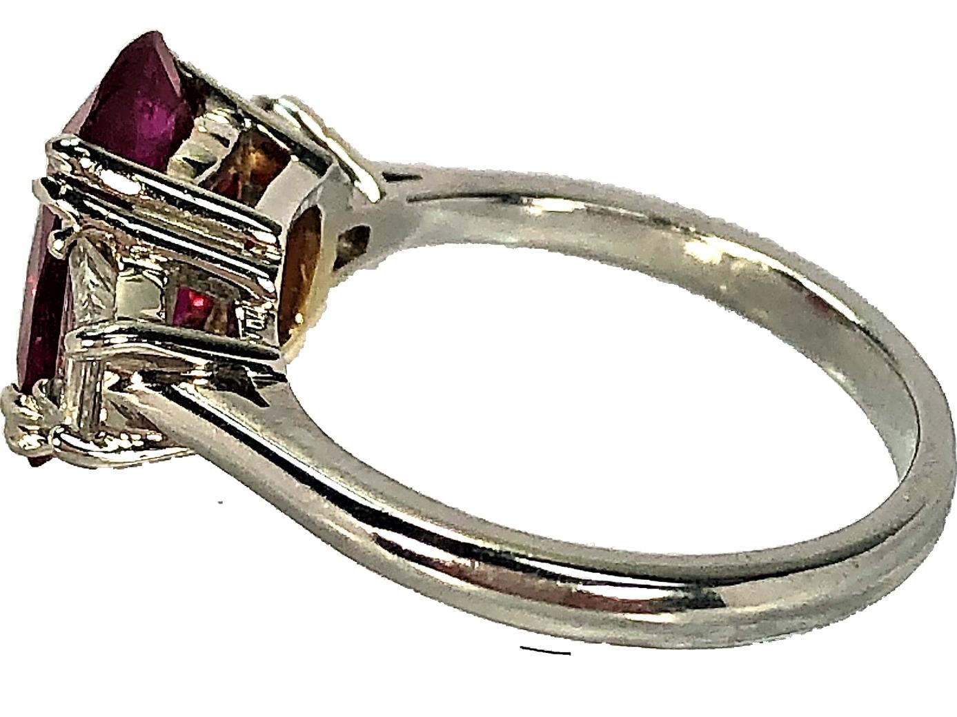 Cushion Cut 4.07 Carat Mozambique Ruby and Diamond Three-Stone Ring Set in Platinum