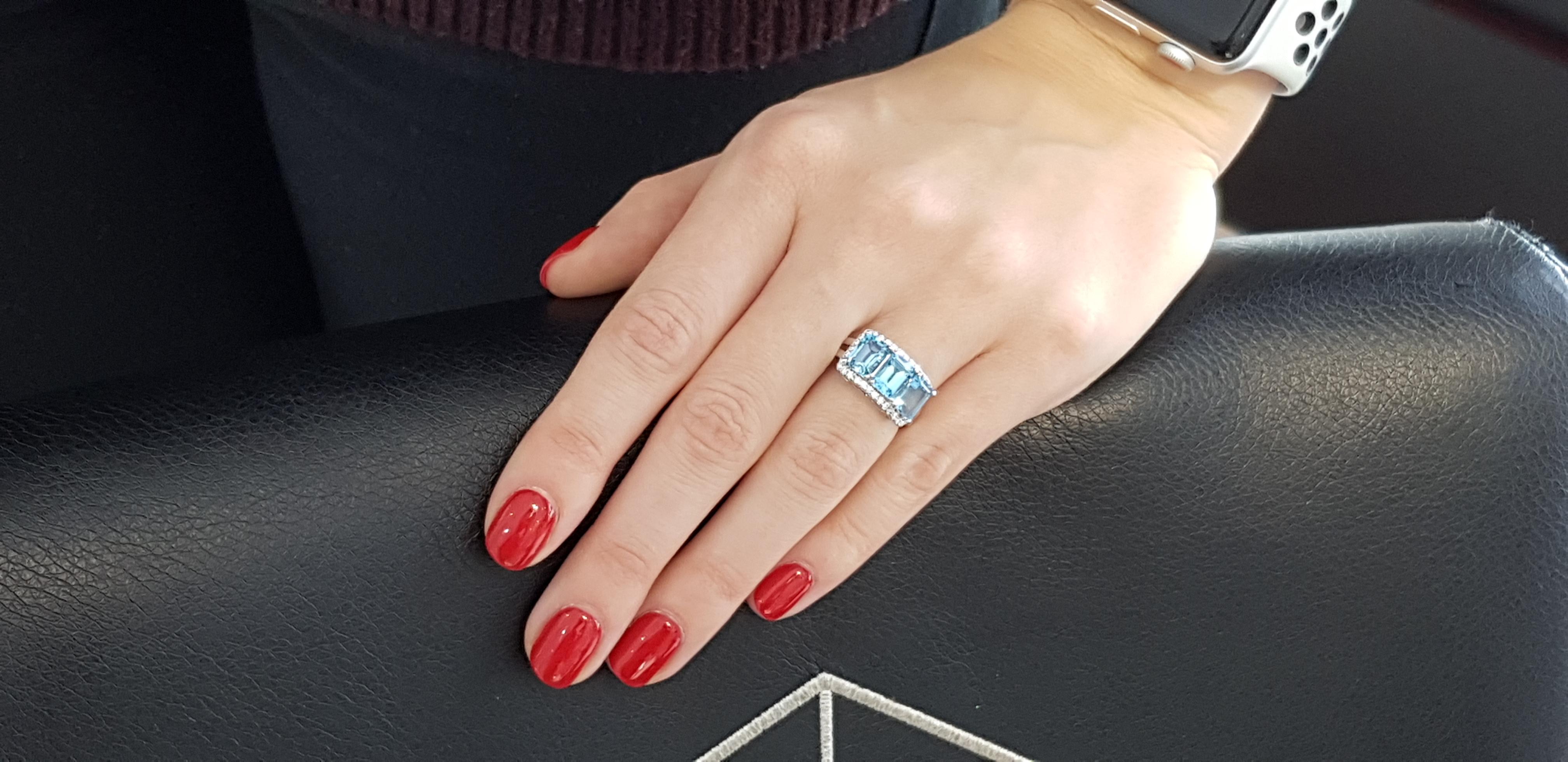 4.08 Carat Emerald Cut Blue Topaz Diamond Halo 18 KT White Gold Engagement Ring For Sale 2