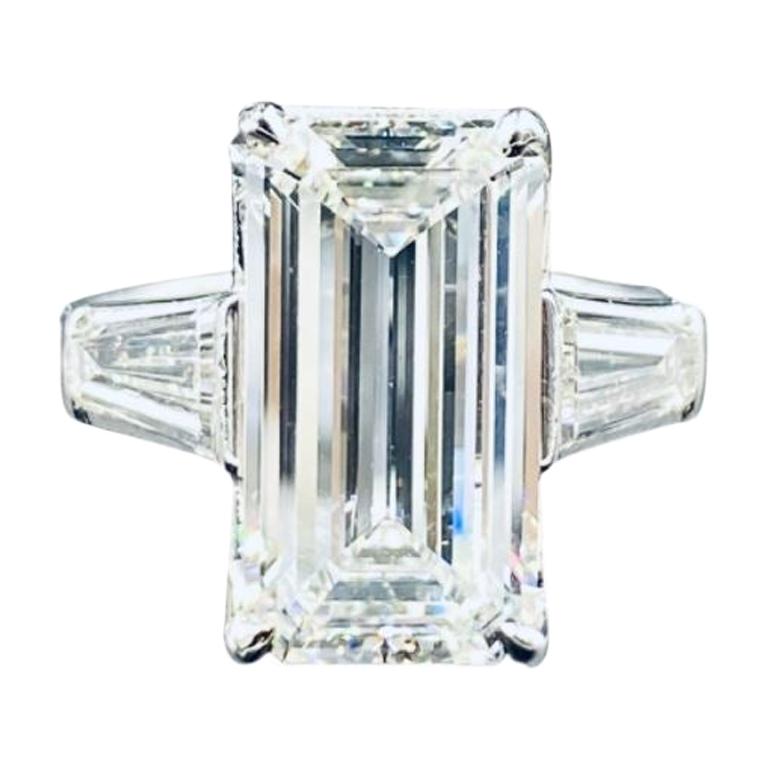 Platinum Engagement Ring with Oval Diamond and Two Tapered Baguettes