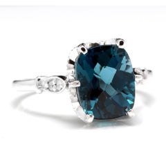 4.08 Carat Natural Impressive London Blue Topaz and Diamond 14 Karat Gold Ring