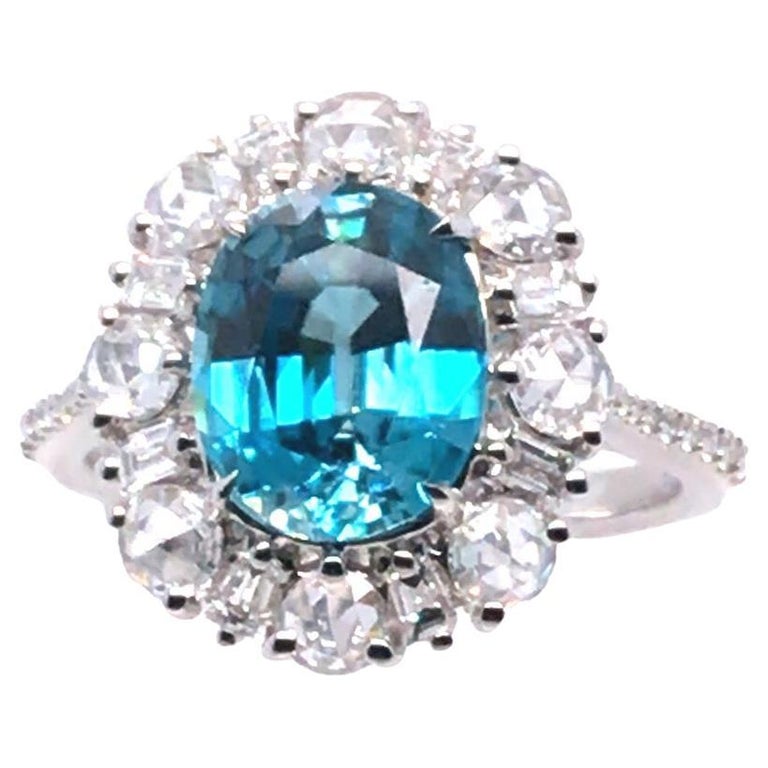 4.08 Carat Oval Cut Blue Zircon and 0.96 Carat Diamond Ring in 18k White Gold For Sale