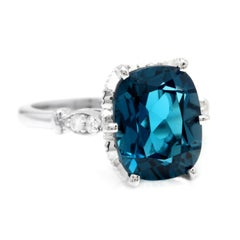 4.08 Carat Natural Impressive London Blue Topaz and Diamond 14 Karat Gold Ring