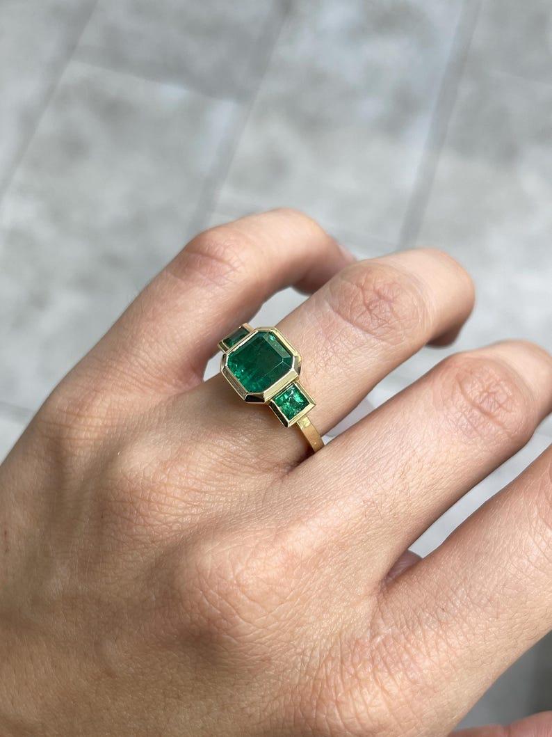 4.08tcw 14K Asscher Cut Emerald Three-Stone Ring - Rich Green Bezel Set Gold In New Condition For Sale In Jupiter, FL