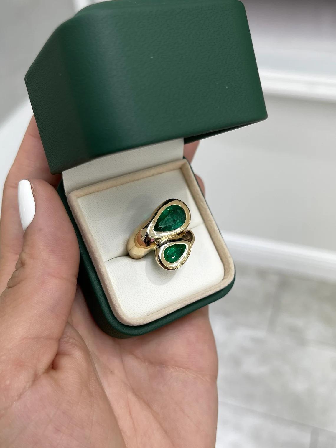 4.08tcw Dark Green Tear Drop Emerald Bypass Two Stone Bezel Statement Ring 14K In New Condition For Sale In Jupiter, FL