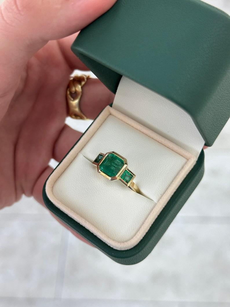 4.08tcw 14K Gold Asscher Cut Emerald Trilogy Ring, Princess Cut Accent, Bezel Se For Sale 2