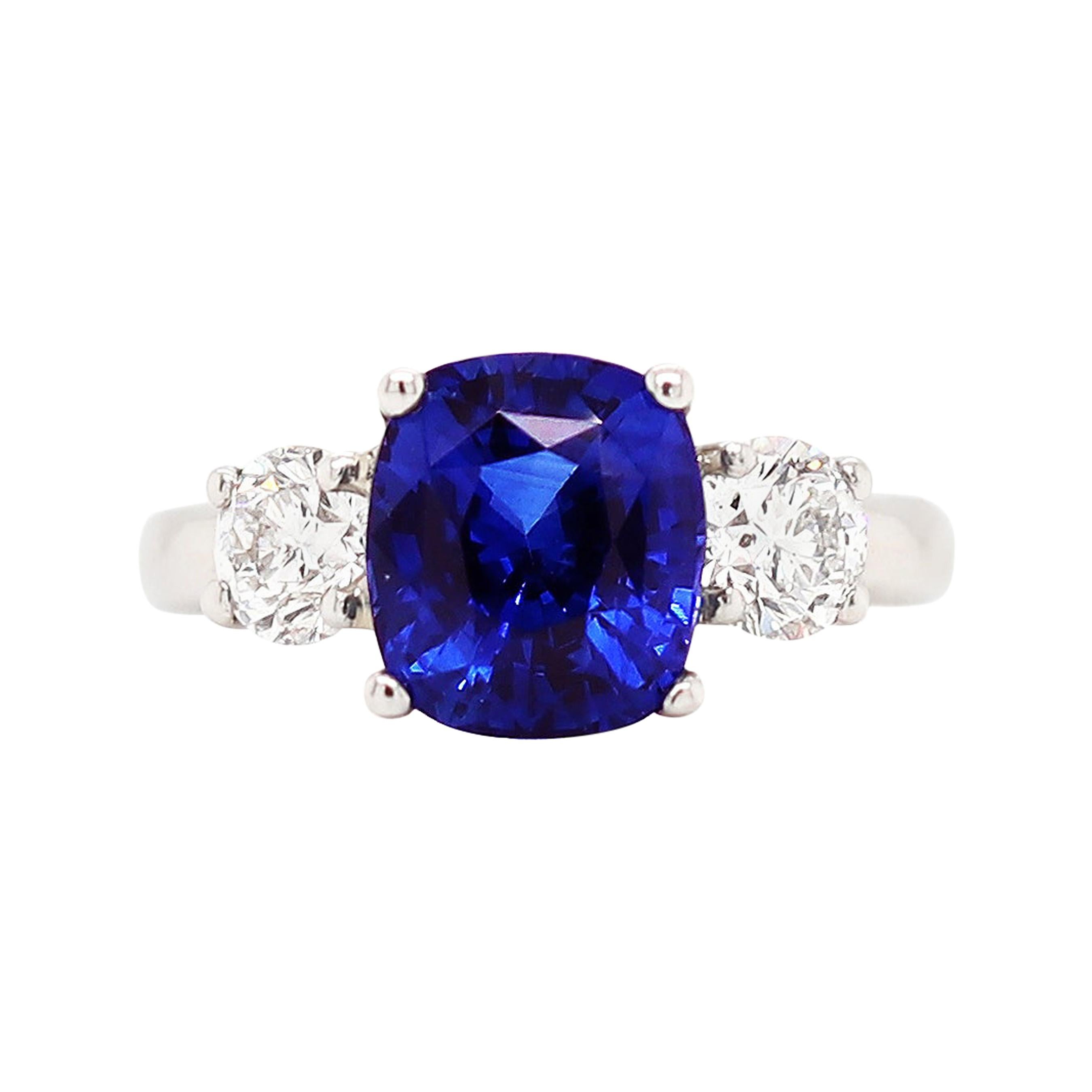 4.09 Carat Cushion Sapphire and Diamond Three-Stone Platinum Engagement Ring For Sale