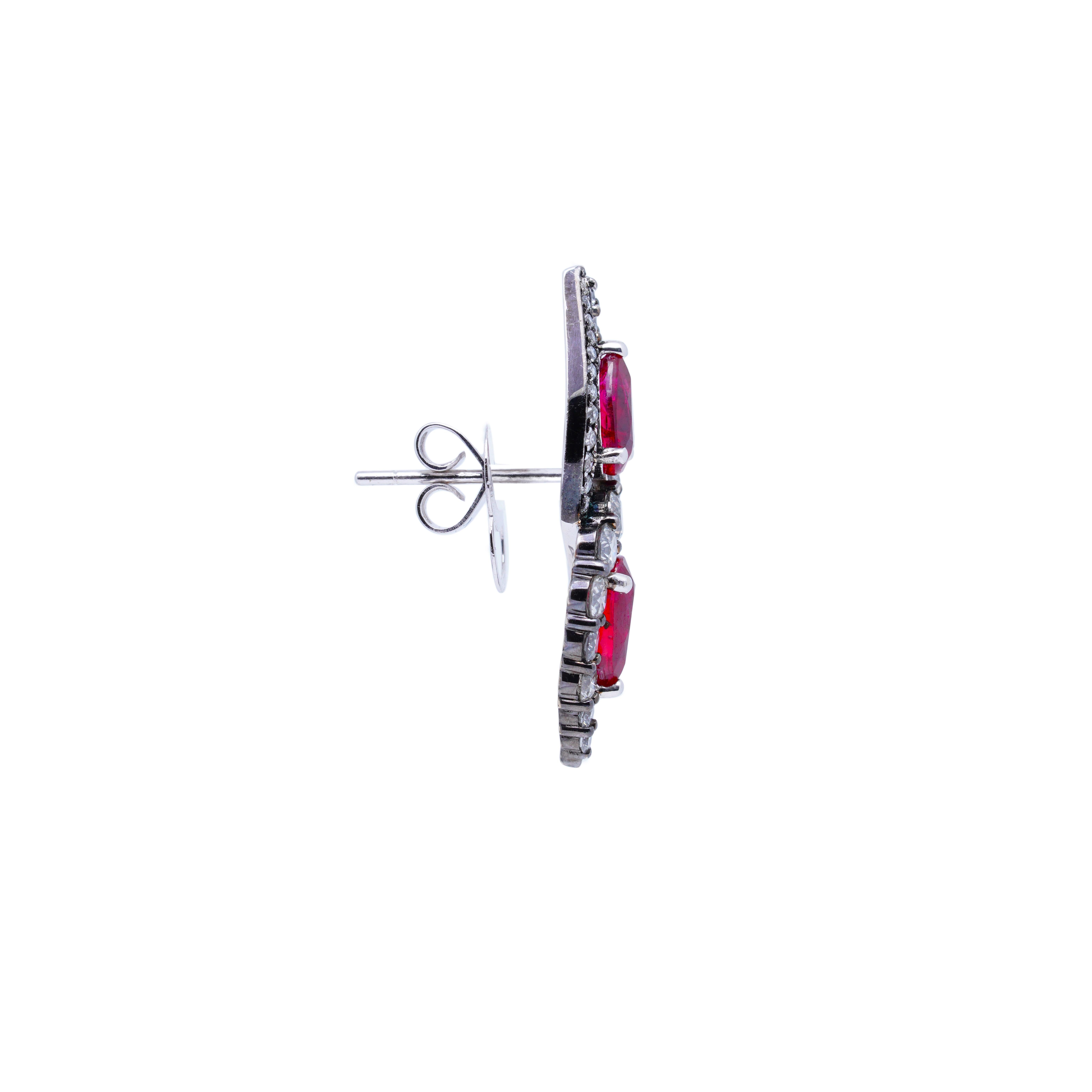 Presenting a pair of stud earrings that exudes simplicity and elegance. These exquisite earrings showcase four pieces of pear-shape Mozambican Unheated Rubies with approximately 1 carat each, carefully selected for their rich hue and natural beauty.