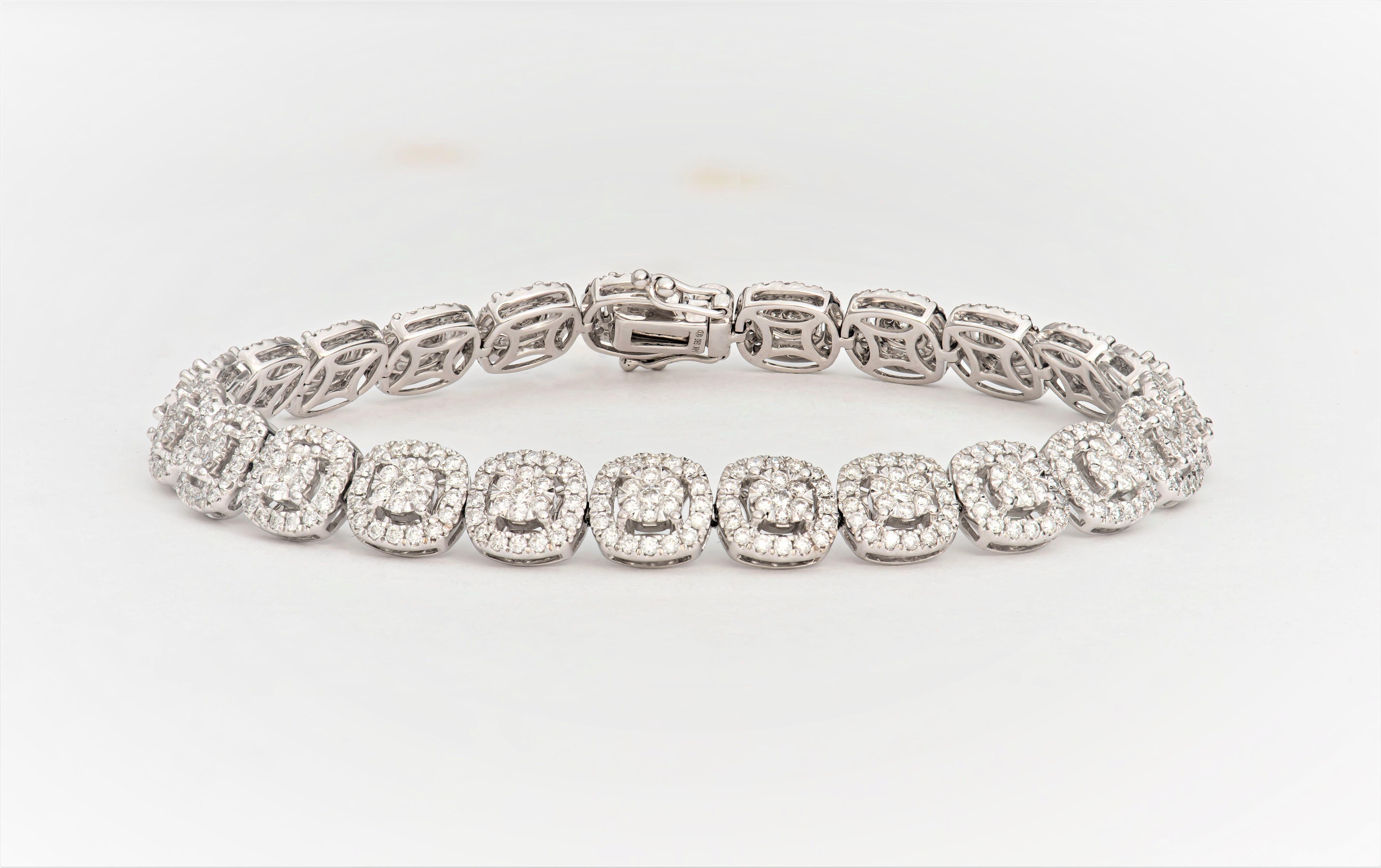 4.09 Carats total weight fine round brilliant cut diamonds set in cluster and cushion halo form, crafted at a length of 7 inches in 14K white gold. Beautiful combination of brilliance and elegance that makes a perfect addition for any night out.