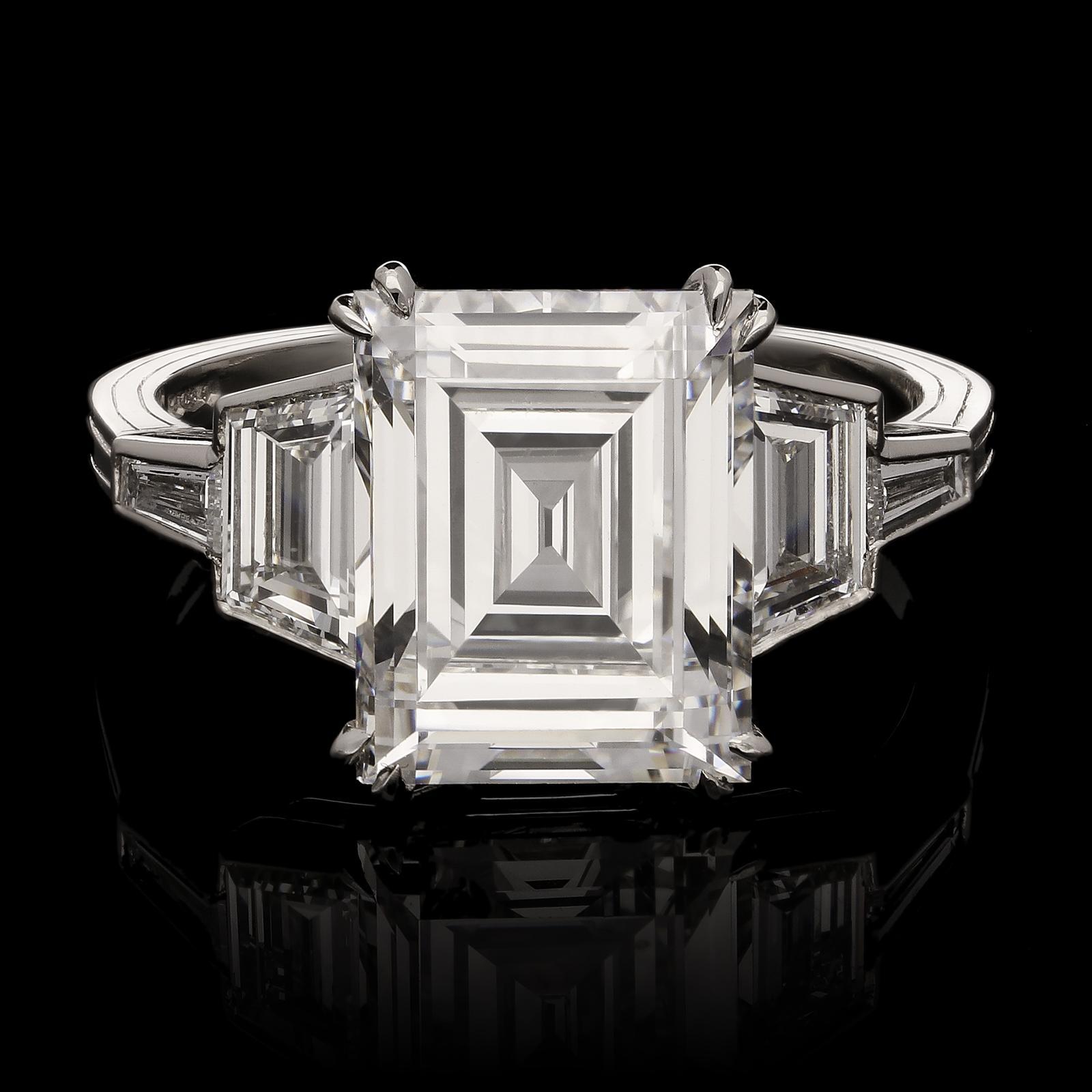 A stunning carré-cut diamond ring by Hancocks, centred with a vintage cut carré diamond weighing 4.09cts and of F colour and VS1 clarity corner claw set in platinum between shoulders set with trapezoid and tapered baguette diamonds, these create a
