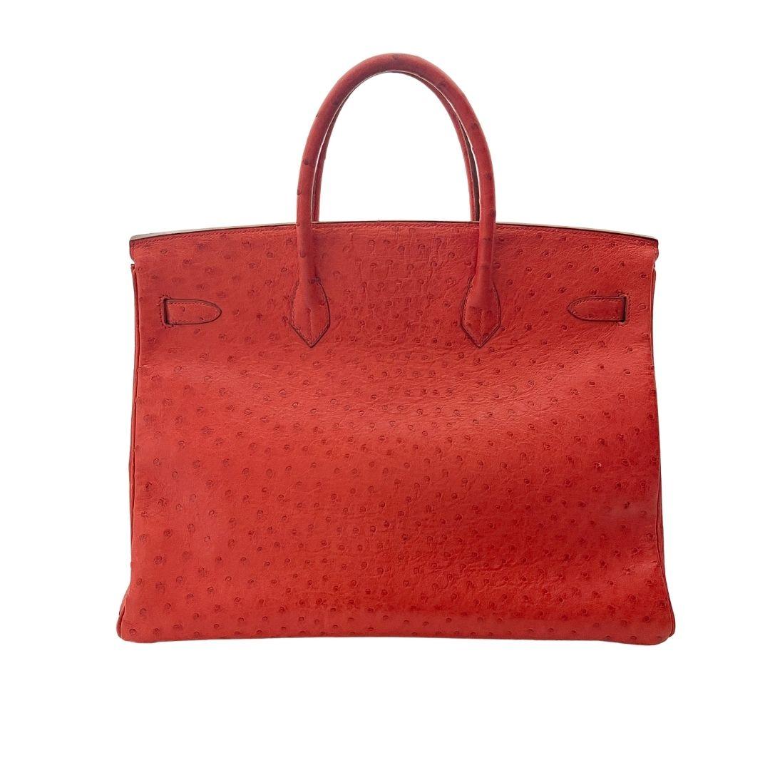 More than just a purse, Hermes Birkin bags are coveted items that grow in value. This would be great for your collection and is an investment. 

This iconic handbag is 40cm with gold hardware. The red (rouge) is light with a hint of orange. The