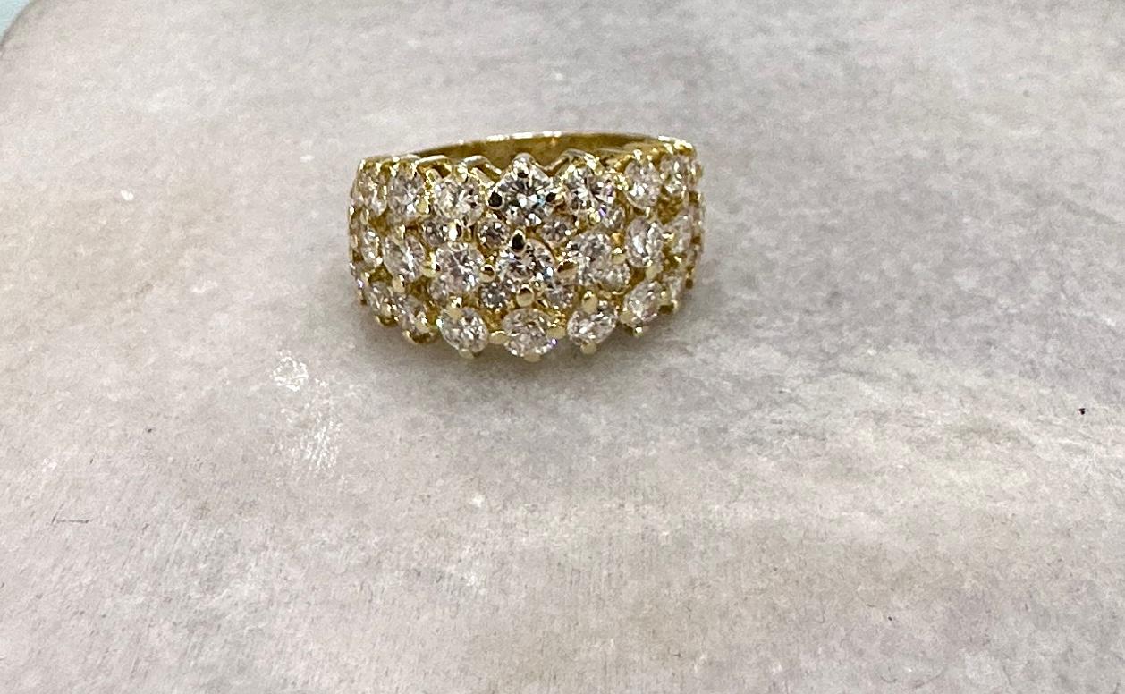 We Call this one The Honeycomb Ring.
It's Crafted in 18KT Yellow Gold.
It Features 4.00 Carats of Dazzling Brilliant Round Diamonds.
F-G Color  VS-SI Clarity. 
The Top of the Ring measures 12.3mm wide and the Shank Tapers to 4.2mm.
The Ring is a