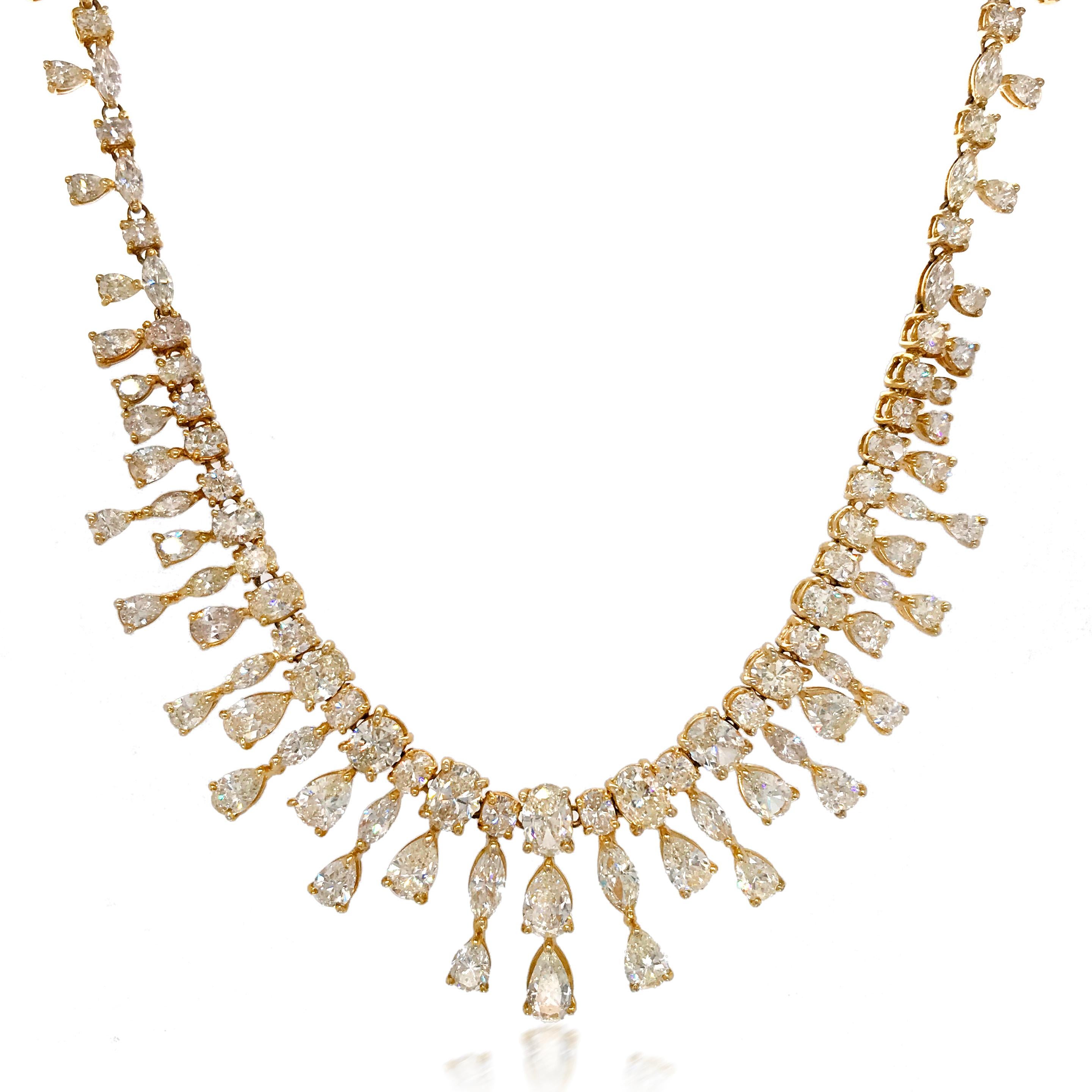 This elegant diamond necklace is handcrafted in solid 18K yellow gold, weighing 41.6 grams and measuring 49.5cm (19.5'') long. This eye-catching diamond necklace constitutes round-, marquise-, pear- and oval-cut diamonds. The high quality diamonds